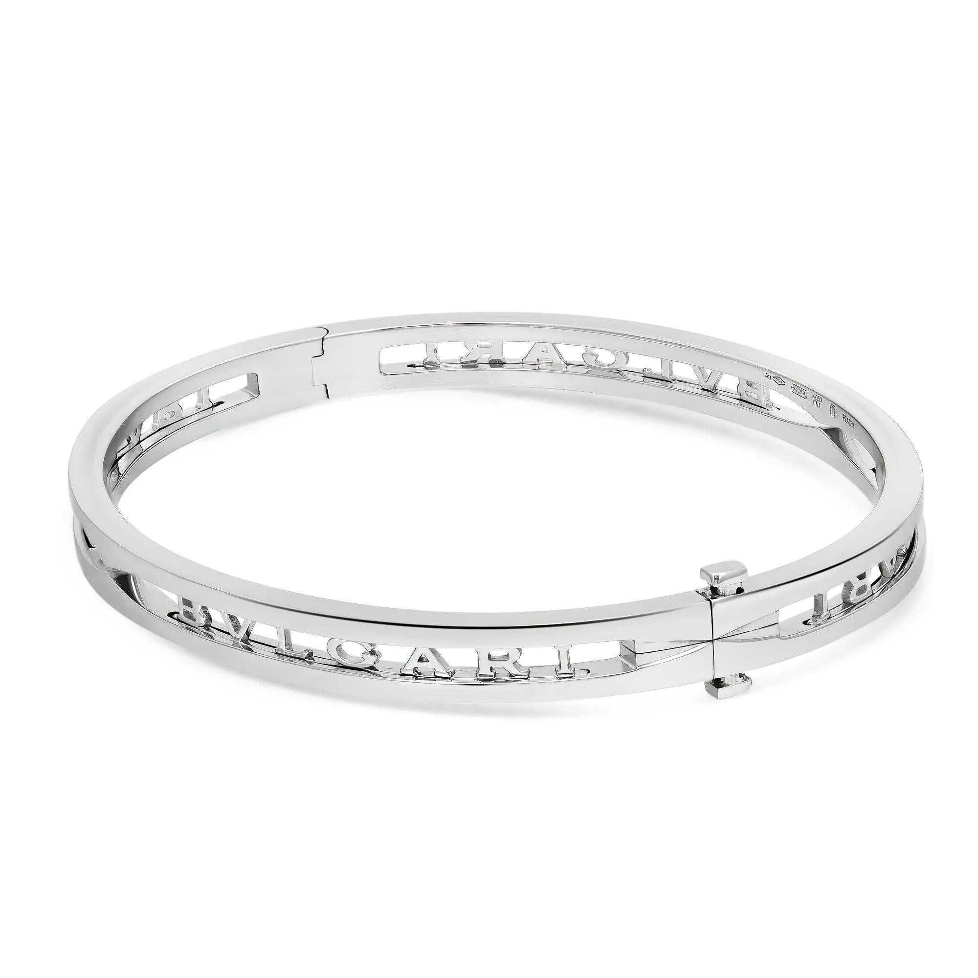 Bold and beautiful, this bracelet is a true essence of jewelry aesthetics. Crafted in lustrous 18K white gold. This bracelet features an oval-shaped bangle with the Bvlgari logo cut out. Super stackable and easy to wear. Size: Medium ( fits up to 7