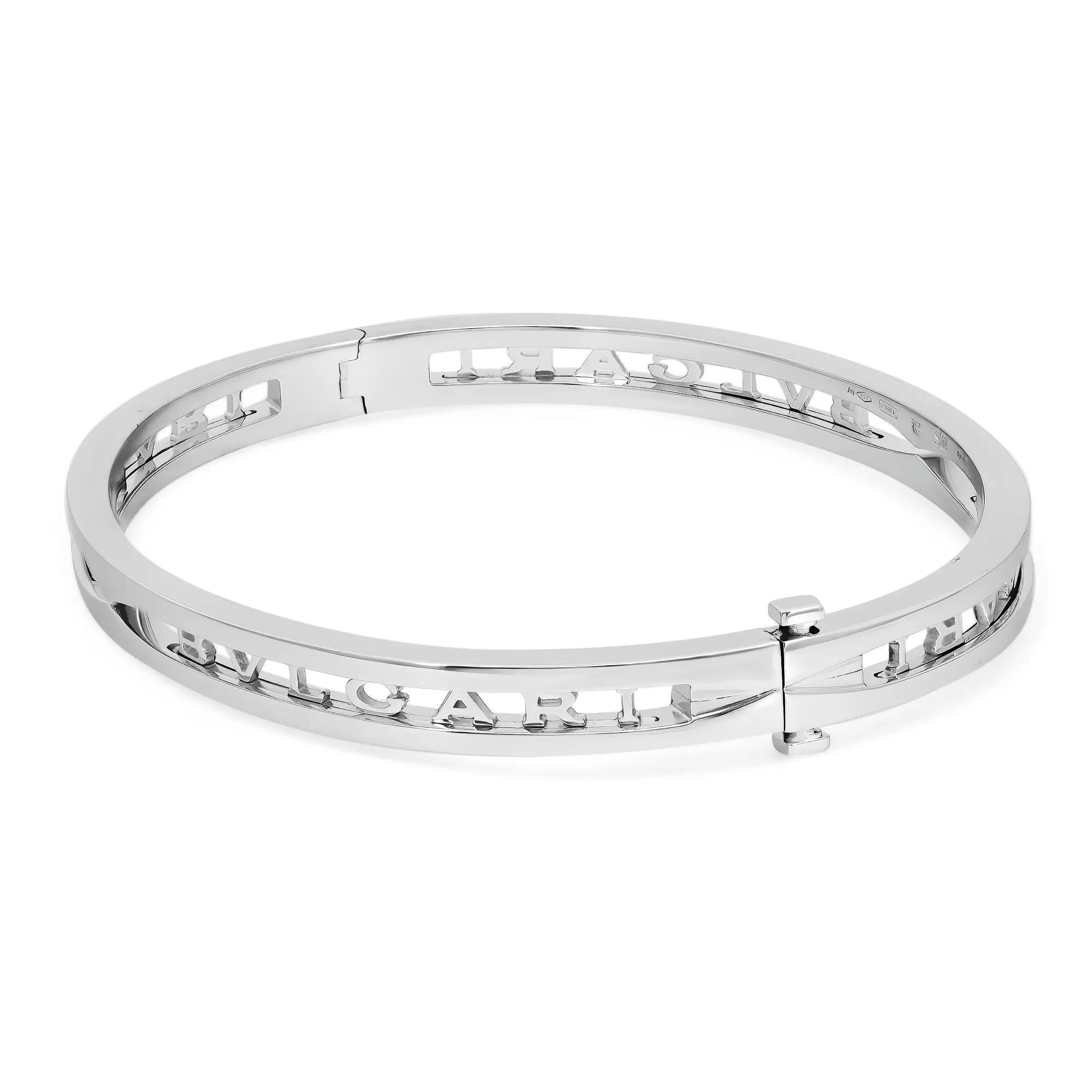 Bold and beautiful, this bracelet is a true essence of jewelry aesthetics. Crafted in lustrous 18K white gold. This bracelet features an oval-shaped bangle with the Bvlgari logo cut out. Super stackable and easy to wear. Size: Small ( fits up to 6.5