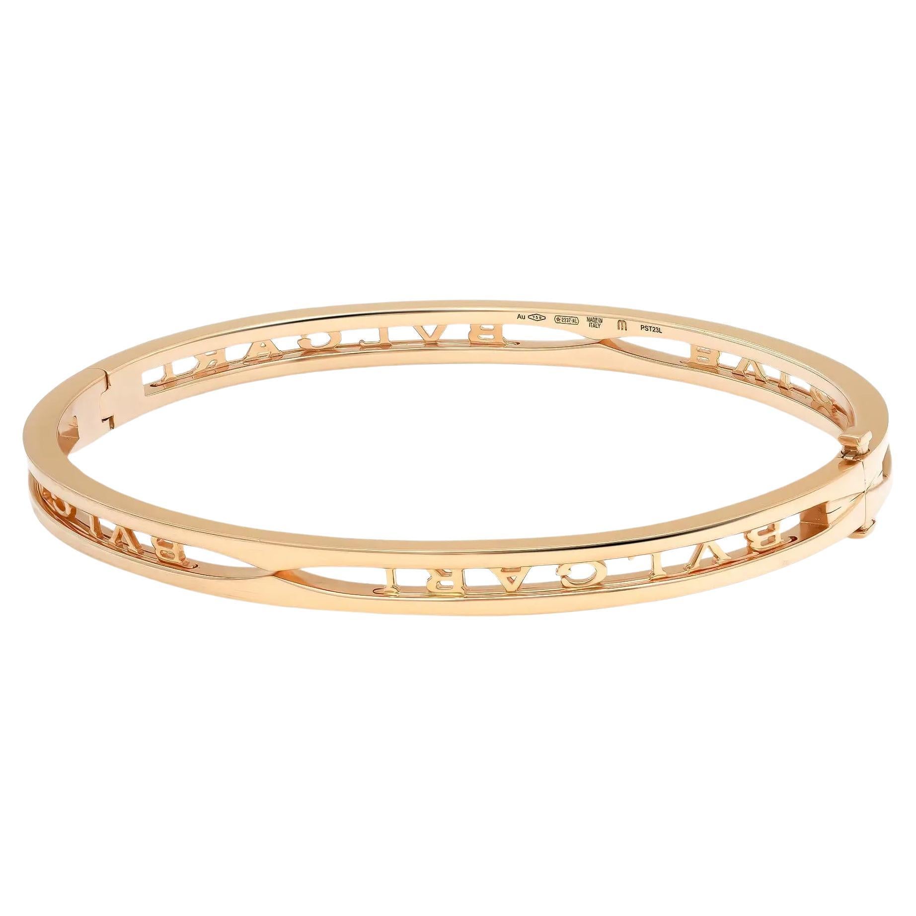 Bold and beautiful, this bracelet is a true essence of jewelry aesthetics. Crafted in lustrous 18K yellow gold. This bracelet features an oval-shaped bangle with the Bvlgari logo cut out. Super stackable and easy to wear. Size: Medium ( fits up to 7