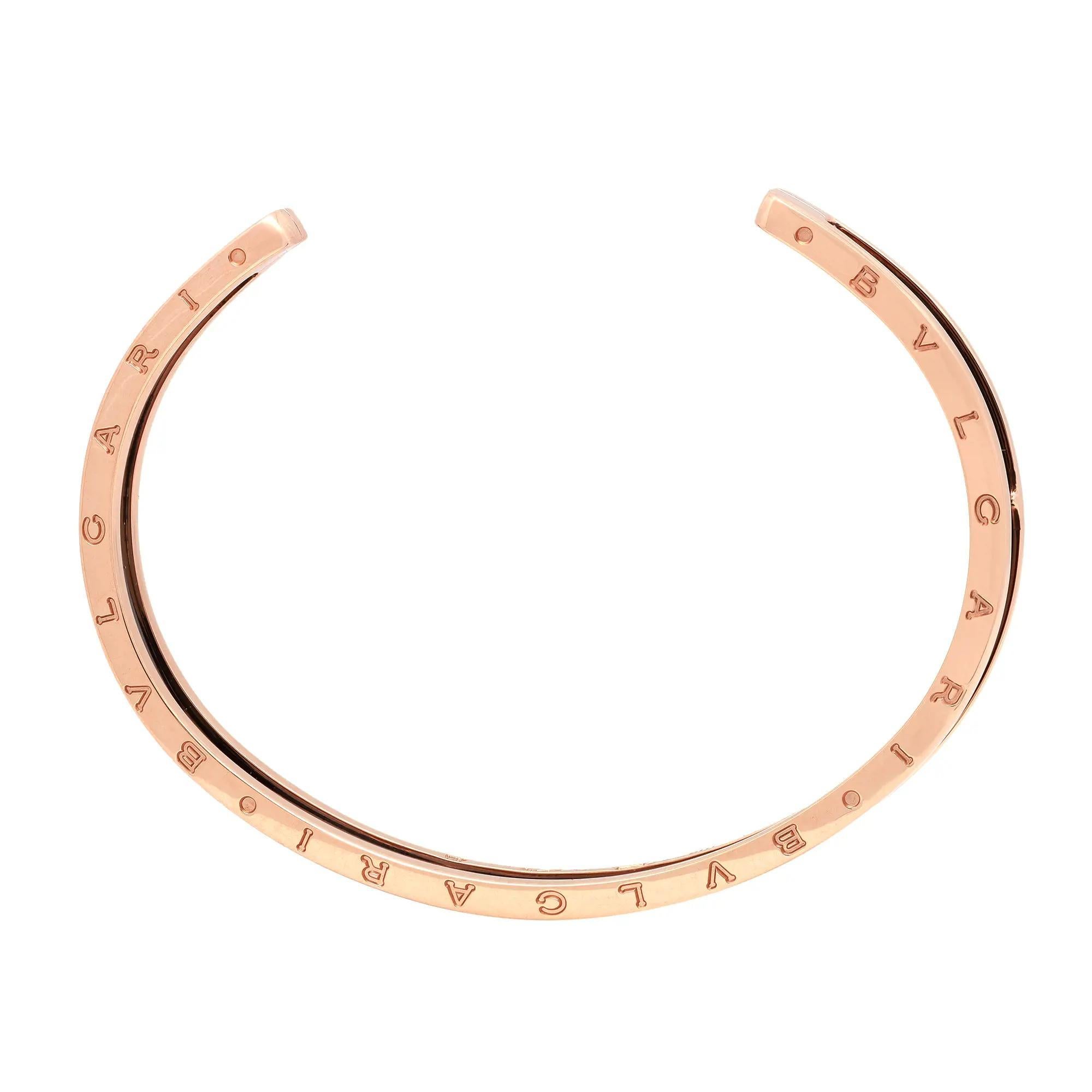 This stunning B.Zero1 open cuff bracelet comes from the house of Bvlgari. Well crafted in 18K rose gold and ceramic. This bracelet features black ceramic in the center with rose gold frame. Bvlgari logo engraving on the edges. Size: Small to Medium.