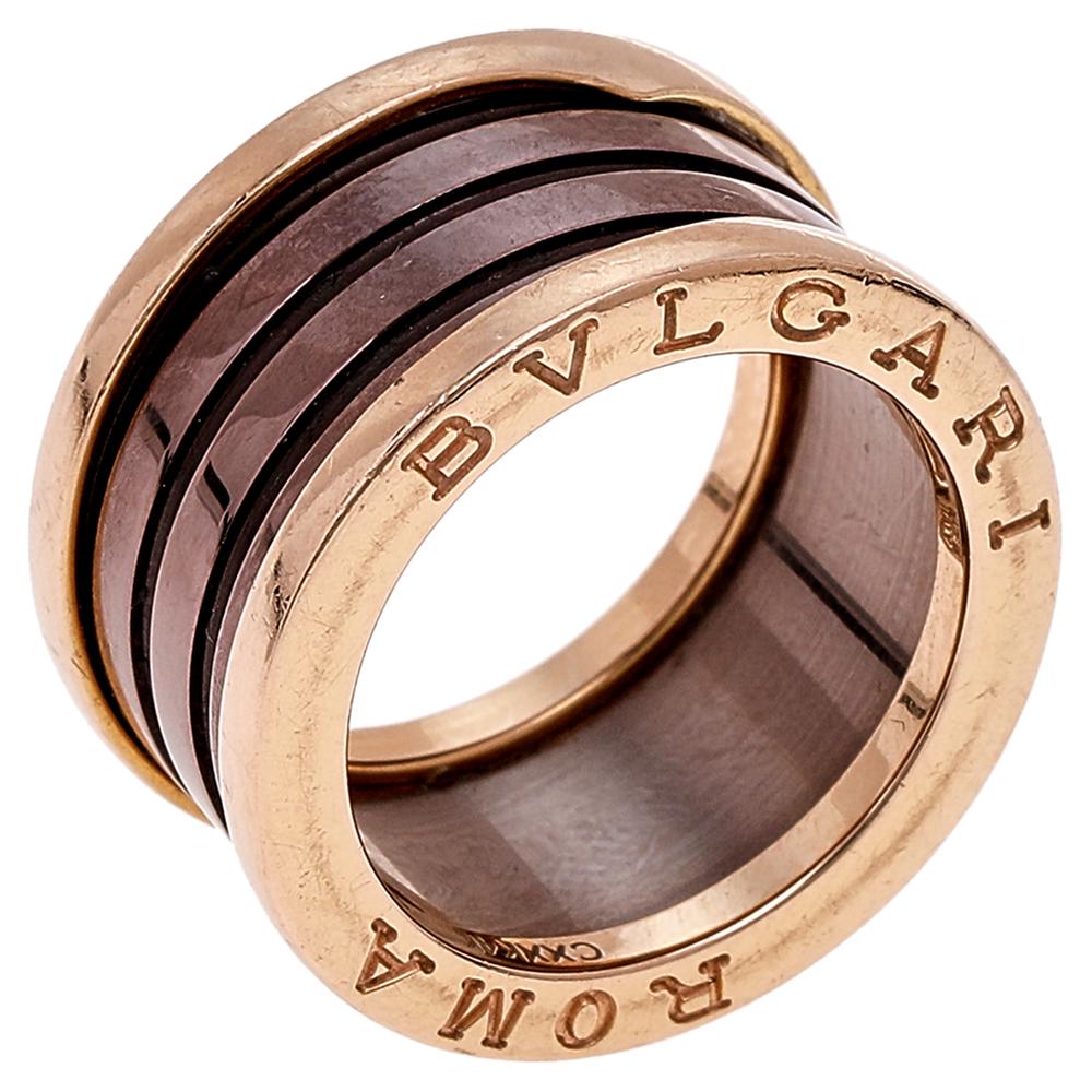 Exquisite details take center stage in this ring from Bvlgari. This B.Zero1 ring comes crafted from 18K rose gold, sculpted as a band, and flaunts 4 bronze ceramic bands stacked together. It has the brand name as well as 'ROMA' engraved on it. Wear