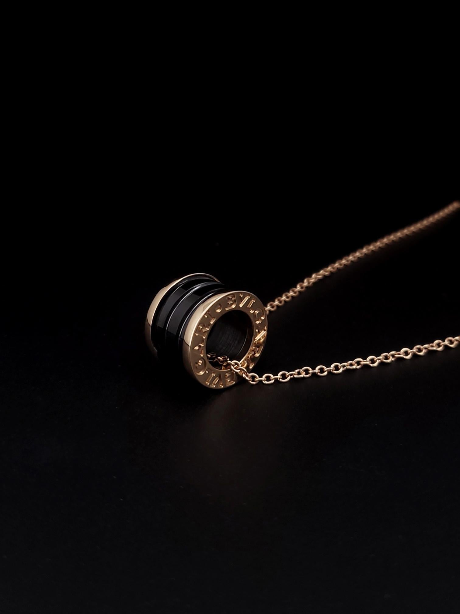 B. Zero1 Rose Gold and Ceramic Pendant Necklace.

-Material: 18k Rose Gold and Ceramic
-Length: Adjustable 18in, 17in, 16in.
-Pendant: 14.5mm (diameter) 10mm (thickness)
-Chain Thickness: 1.5mm
-Weight: 10.9 grams

*Includes Bvlgari Box.