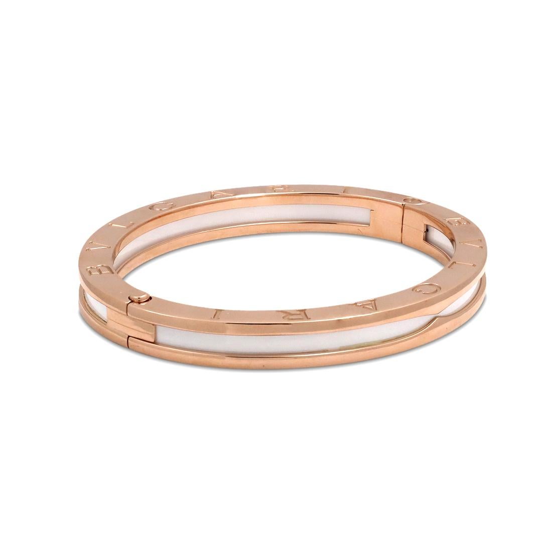 Authentic Bvlgari 'B.Zero1' bracelet crafted in 18 karat rose gold engraved with the Bvlgari logo on both sides. The bracelet has a high polished lip of gold on either side and a center strip of white ceramic. Signed Bvlgari, Au750, M, Made in Italy