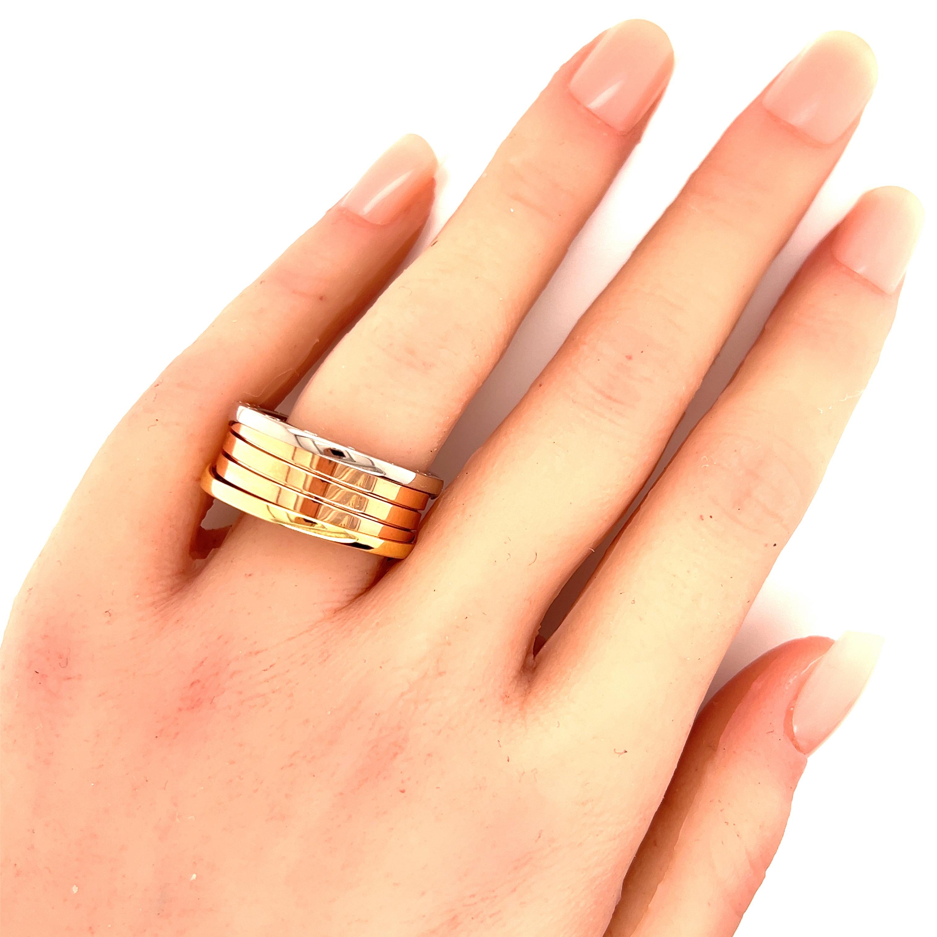 Realizzato con precisione, l'anello Bvlgari B.zero1 a tre fasce sfoggia un sofisticato mix di oro rosa, bianco e giallo a 18 carati. Il design è una dichiarazione di eleganza e lusso, emblematica della rinomata maestria del marchio. Con una misura