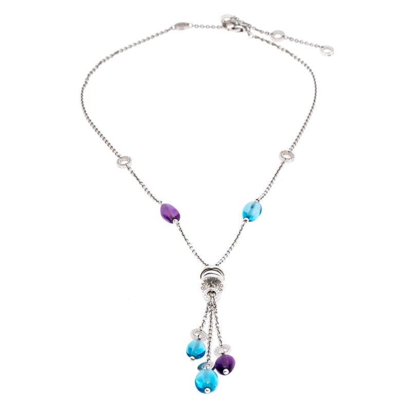 It is definitely Love At First Sight with this Bvlgari necklace. Beautifully crafted from 18k white gold, it is a creation from their B.Zero1 collection. Gorgeous dangling chains holding blue topaz and amethyst fall from a signature stud featuring