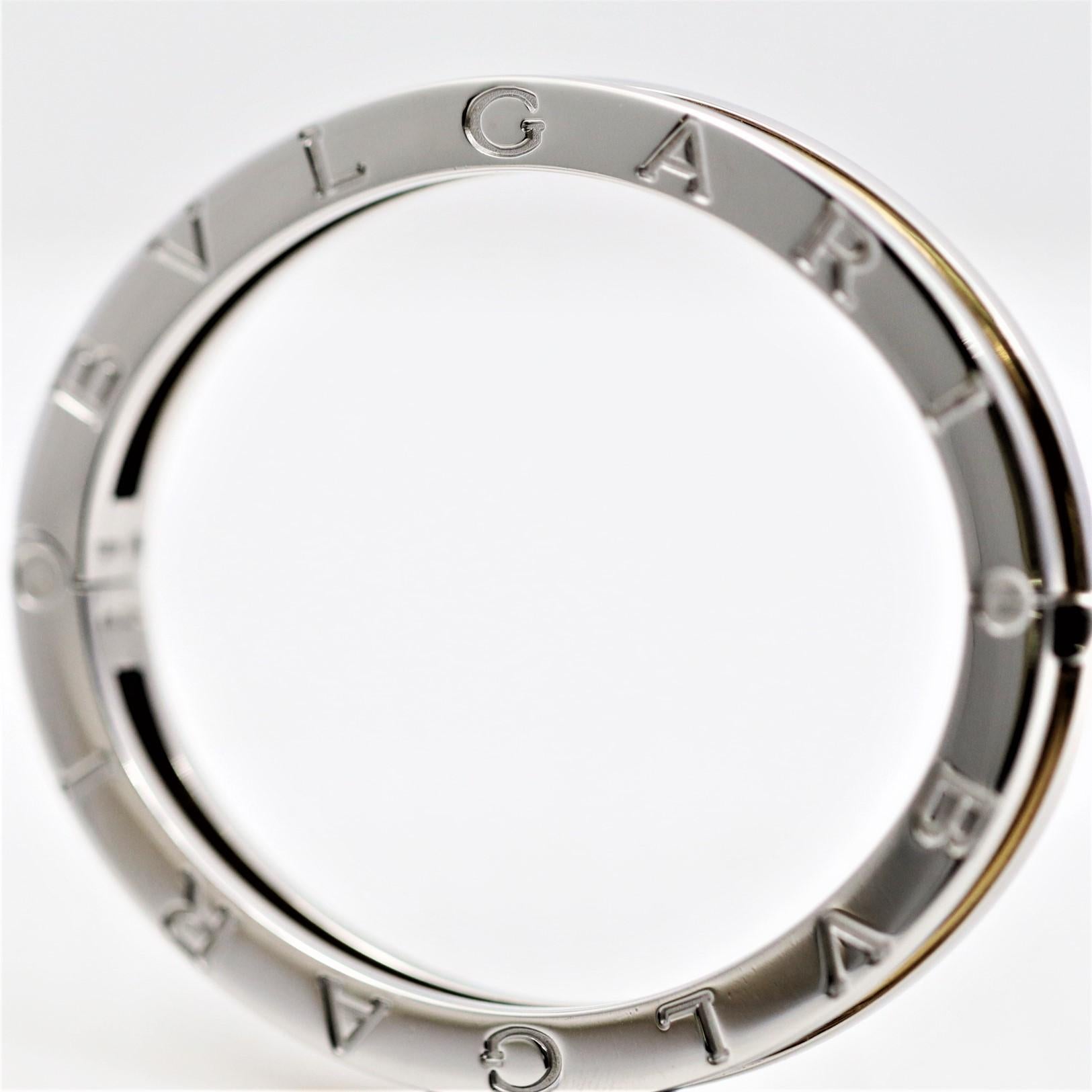 A simple and stylish bangle bracelet by famed Italian jewelry house Bvlgari. It is made of both stainless steel and 18k yellow gold for a luxurious two-toned look. Adding to the bracelet is the word Bvlgari written in large letters around the