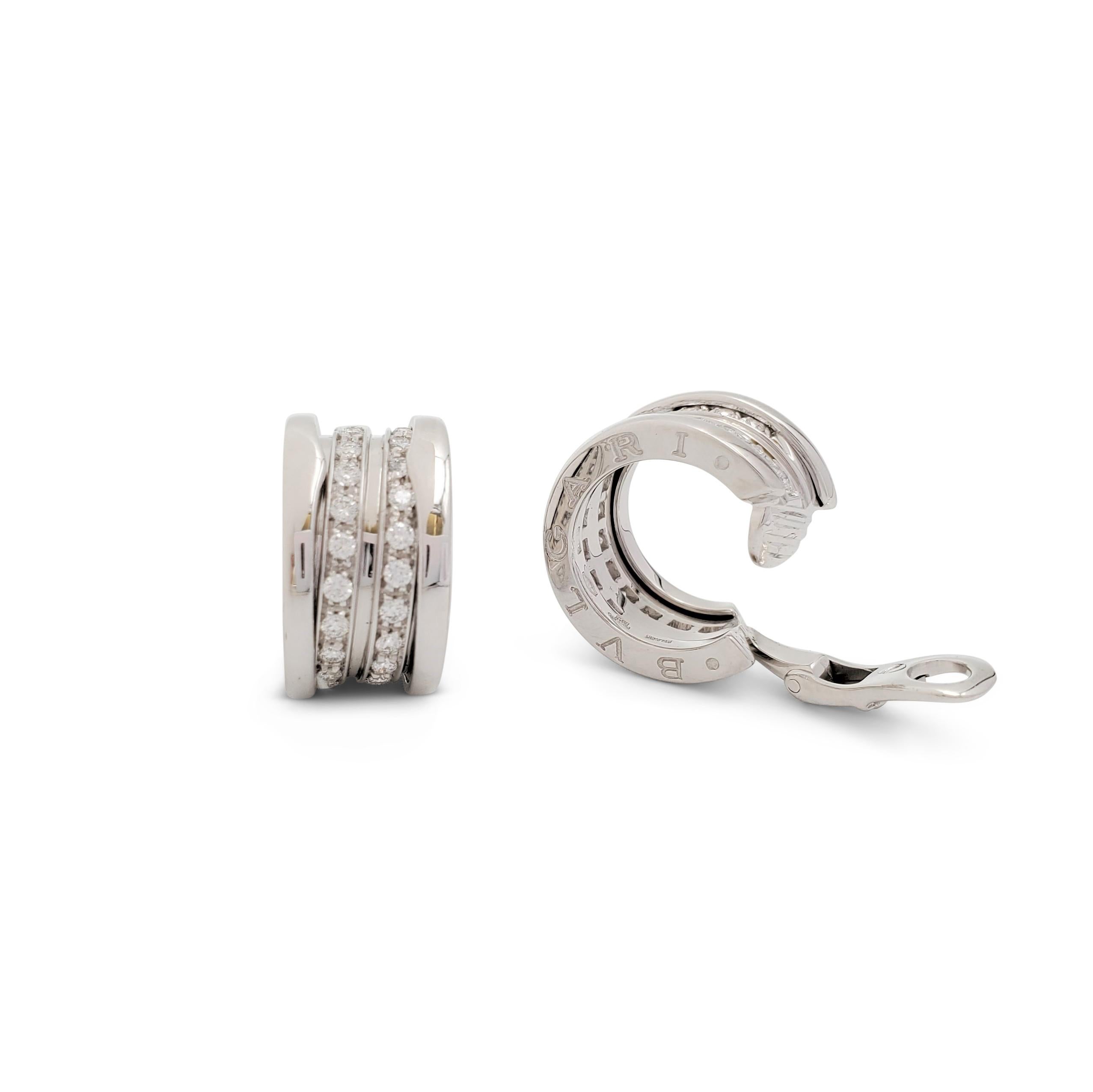 Authentic Bvlgari 'B.zero1' hoop earrings crafted in 18 karat white gold feature two rows of round brilliant cut diamonds (E-F, VS) weighing an estimated 1.08 carats total weight. Signed Bvlgari, Made in Italy, 750, with hallmark. The earrings are