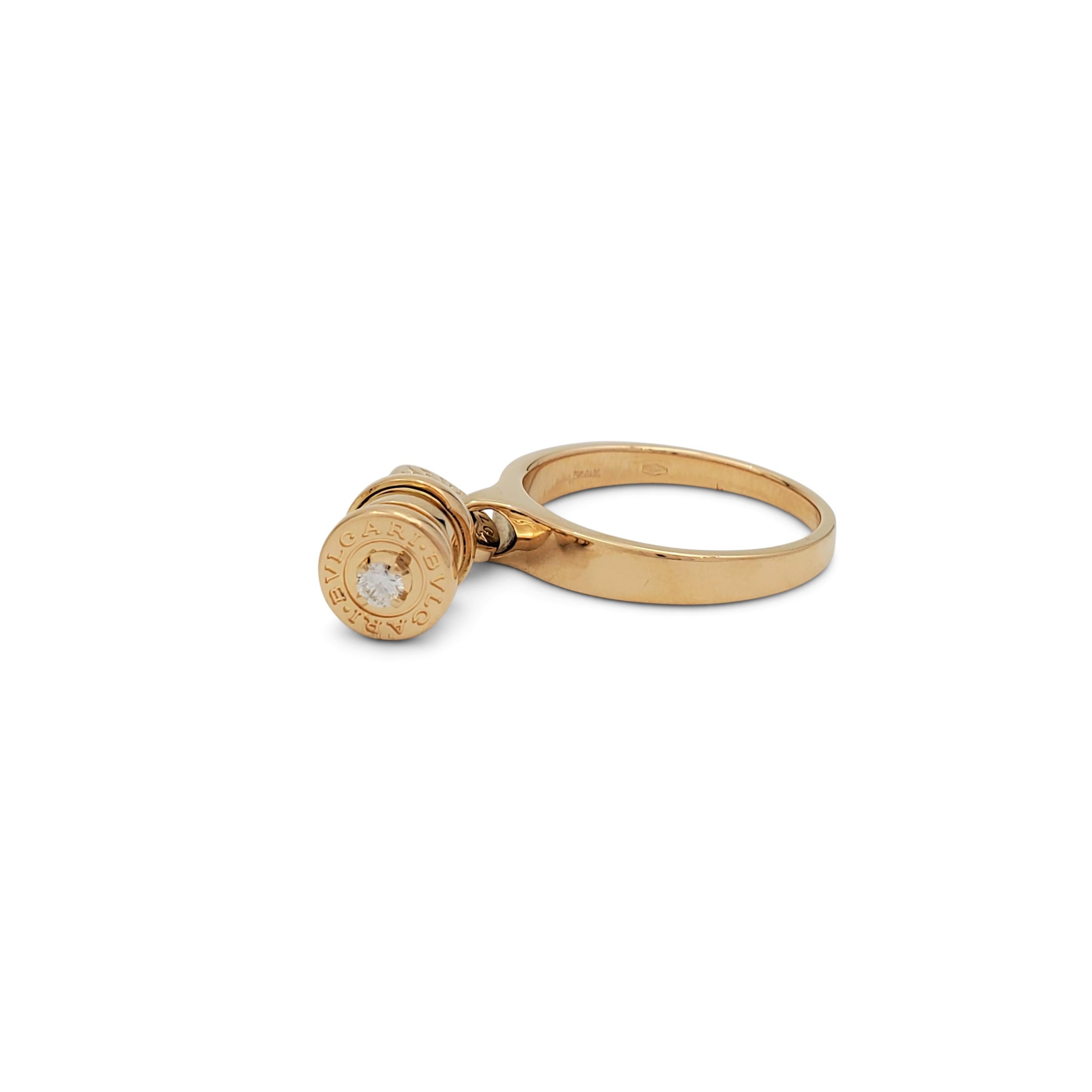 Authentic Bvlgari B.zero1 ring crafted in 18 karat yellow gold features a charm in the house's signature tubogas style set with a single diamond. Signed Bvlgari, 750, Italy, with serial number. The ring is not presented with the original box or