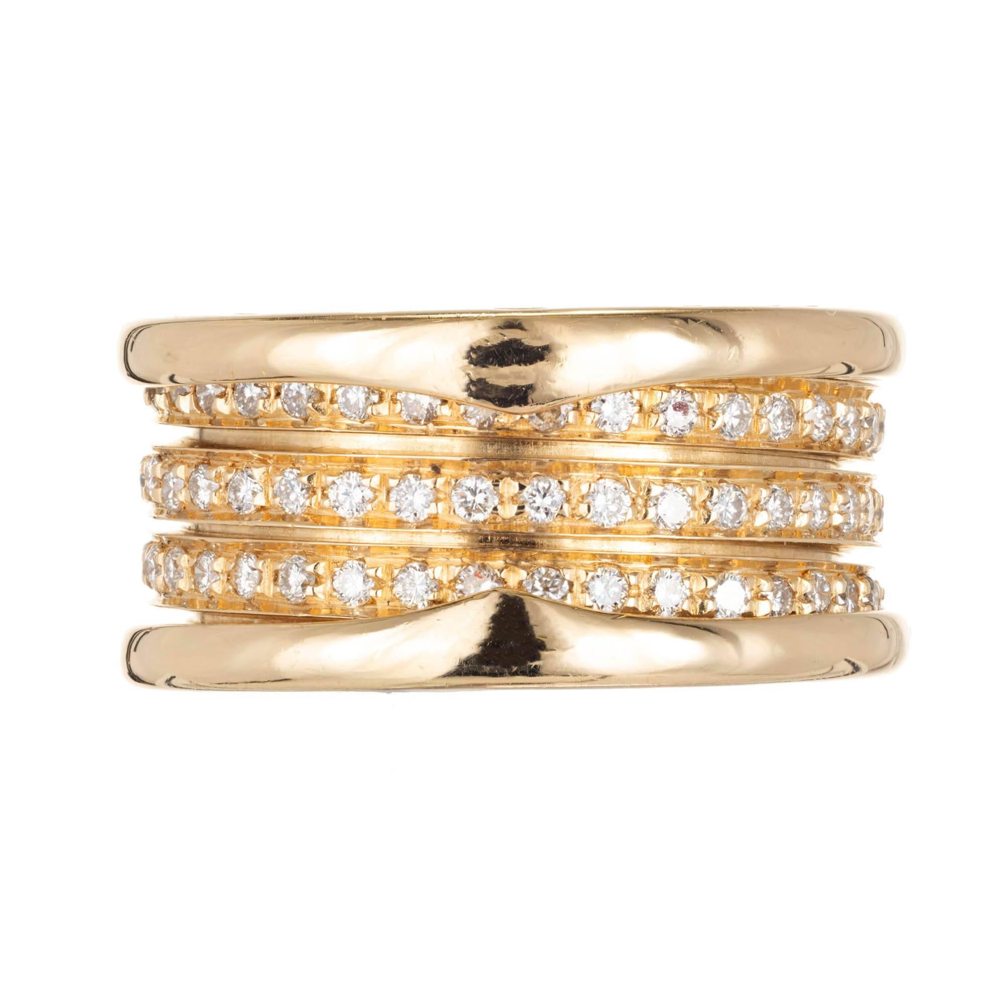 Bvlgari Three band diamond band ring. 18k yellow gold setting with pave diamonds on the spiral.

100 round brilliant cut G VS diamonds Approximate 1.00 carat
Size 6 and not sizable
18k yellow gold
Stamped: 750
Hallmark: Bvlgari made in Italy
12.8