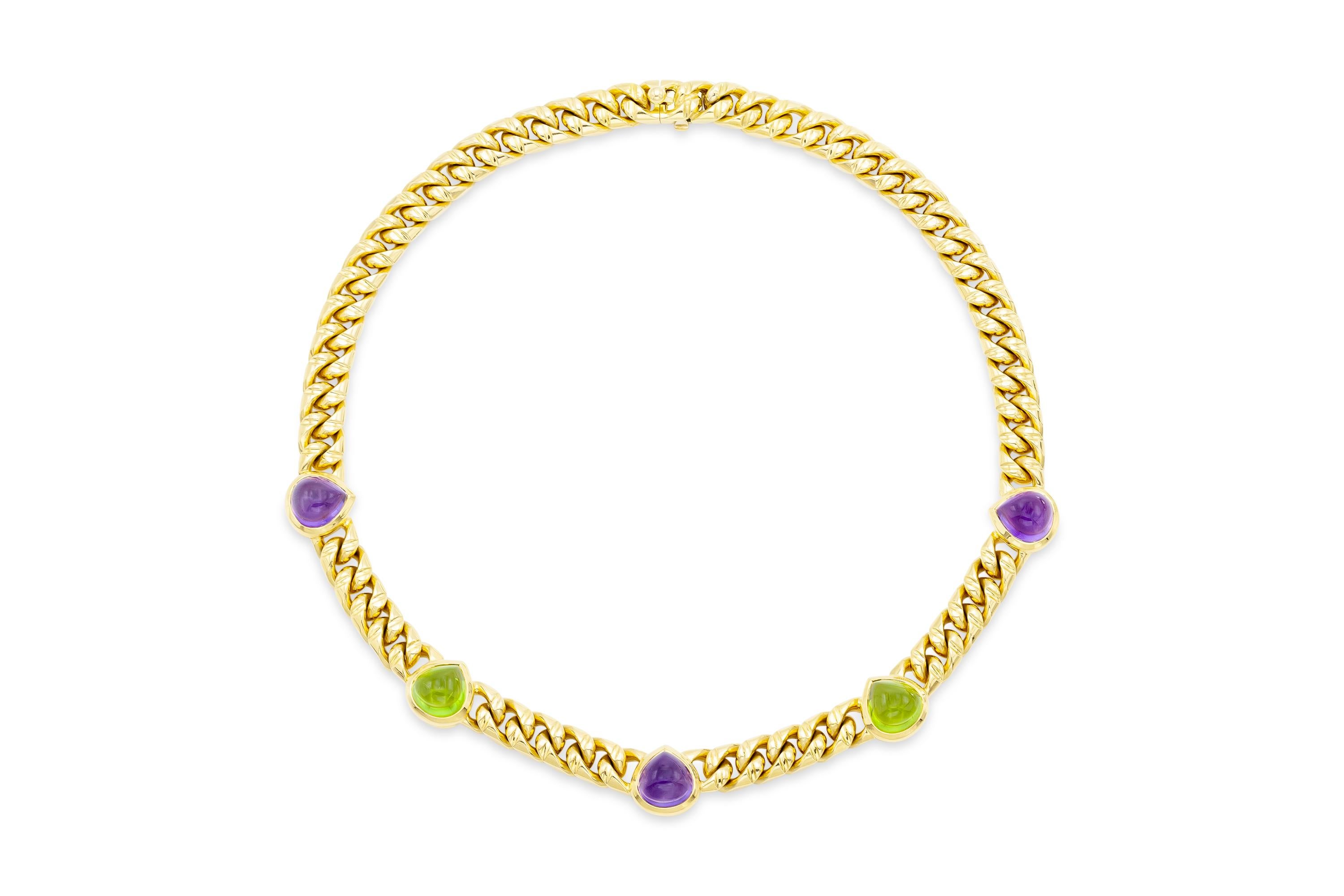 Finely crafted in 18k yellow gold with Cabochon Amethyst and Tourmaline droplets.
Signed by Bvlgari
14 1/2