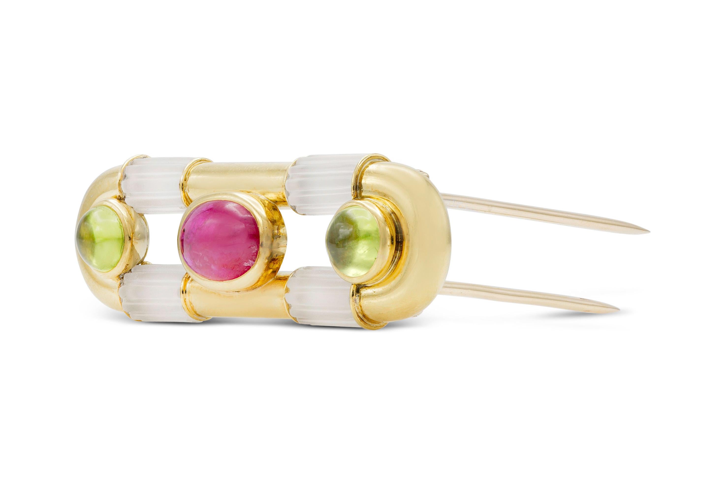 Finely crafted in 18k yellow gold with a cabochon Ruby, two cabochon Tourmalines, and crystals.
Signed by Bvlgari