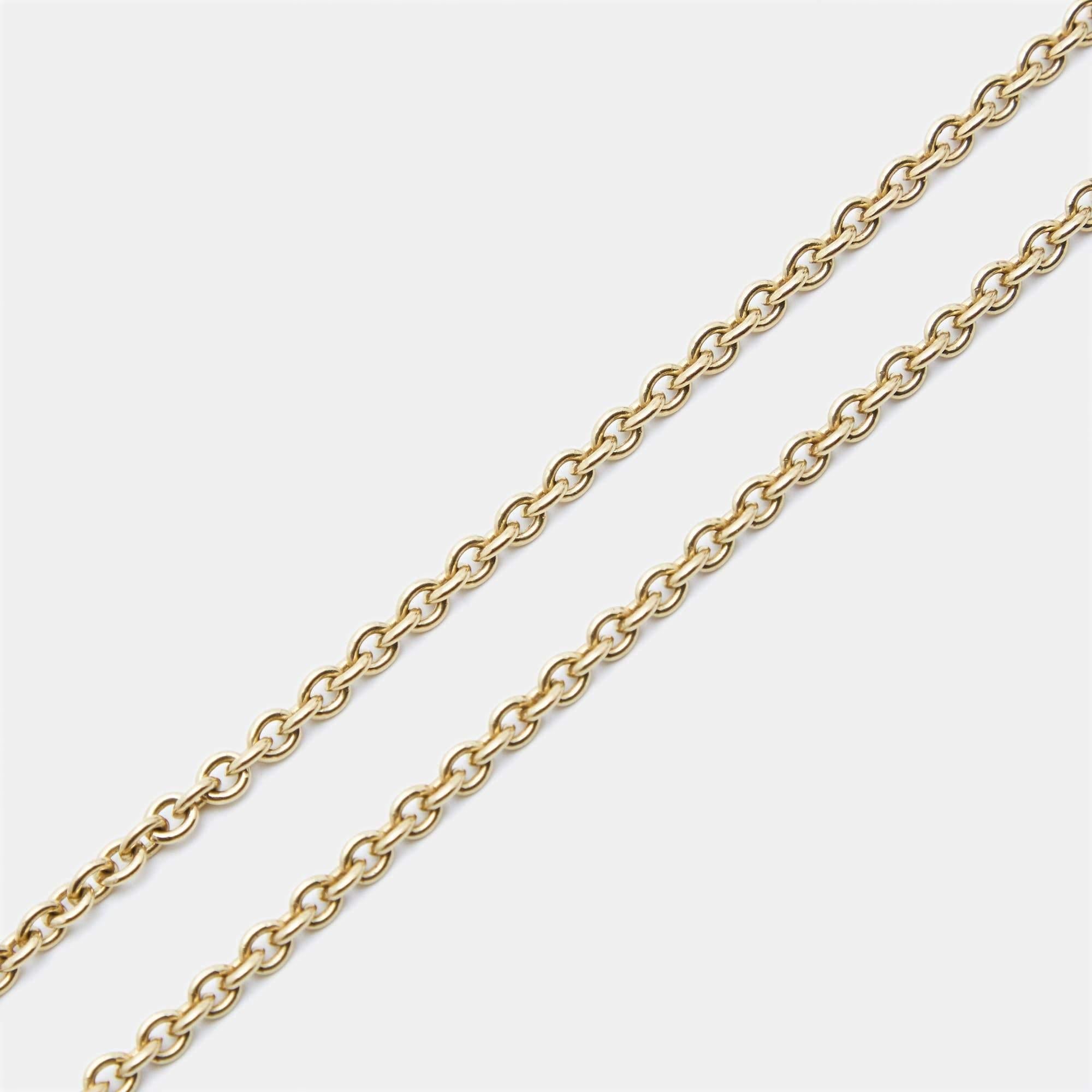 The Bvlgari Catene necklace exudes timeless elegance. Crafted with precision, this exquisite piece features a delicately intertwined chain in radiant 18k yellow gold. The luxurious design seamlessly blends modern sophistication with classic allure,