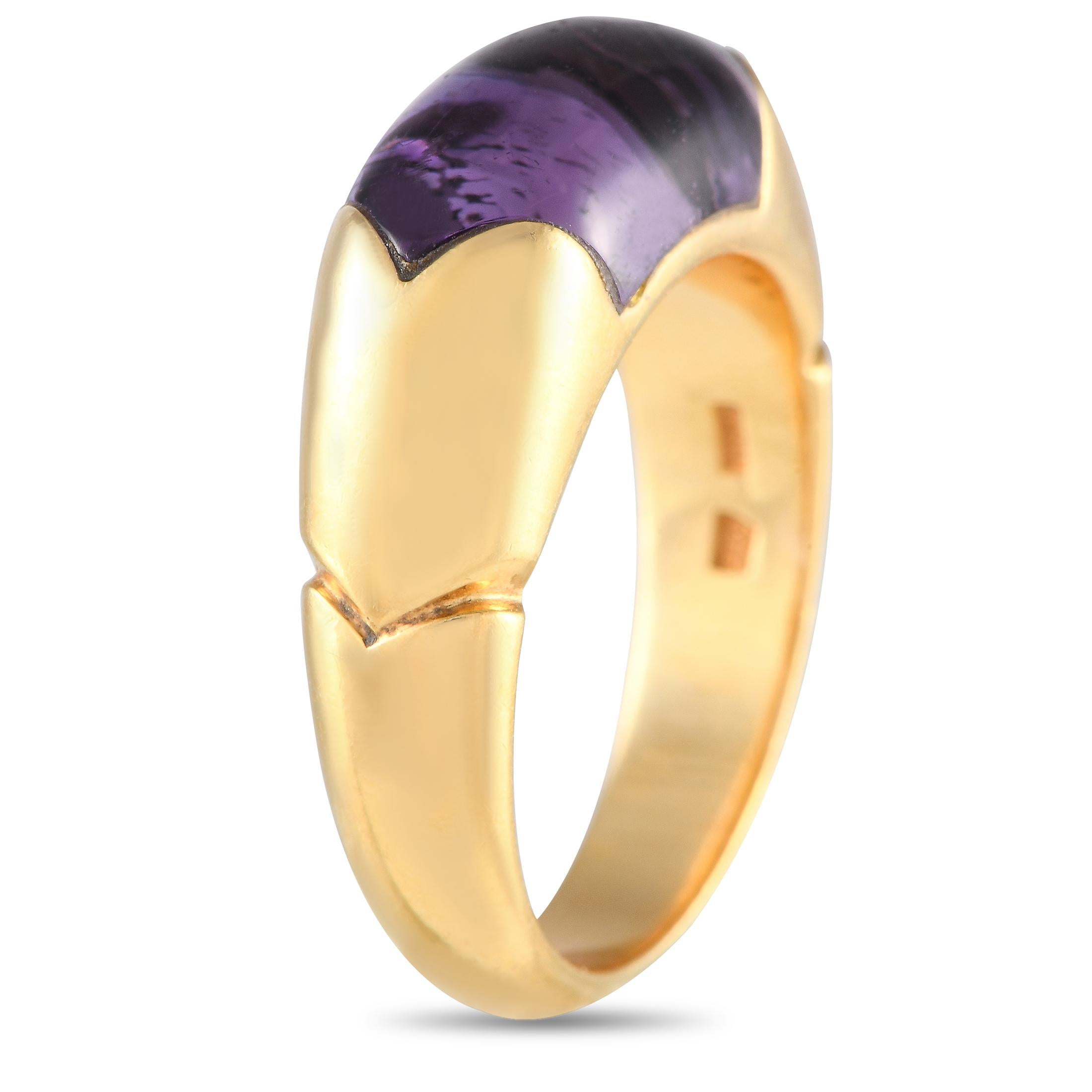 A chunky and stylish Bvlgari ring set with a February birthstone. This Bvlgari Certaura ring in 18K yellow gold holds a deep purple amethyst cabochon. It weighs 7.9 grams and has a Made in Italy stamp. The ring's top dimensions measure 15mm by