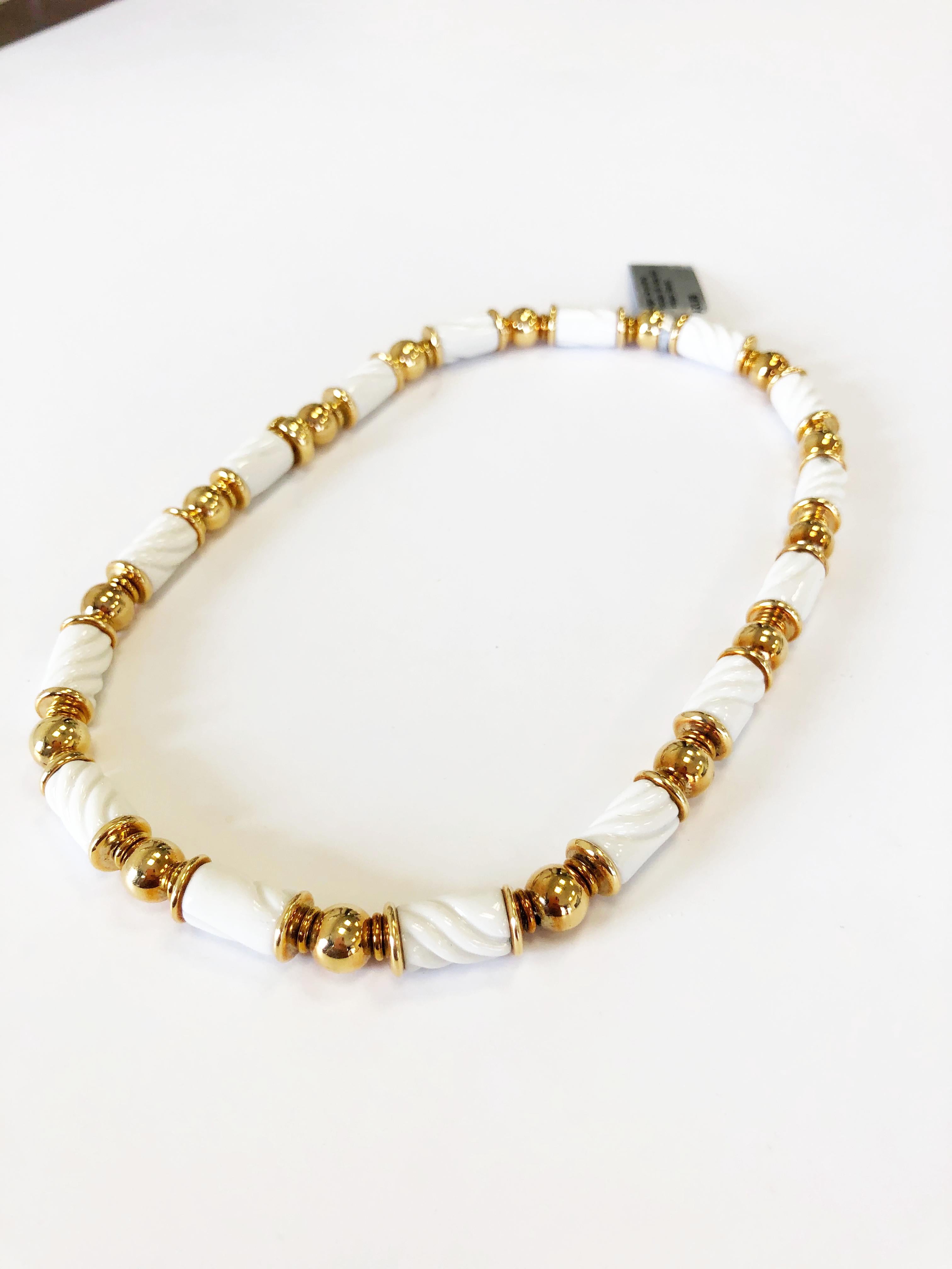 Classic Bvlgari Chandra carved white porcelain necklace in 18k yellow gold.  This design is commonly symbolic to Bulgari and is a part of an entire collection.  Great price for this evergreen piece.  Perfect for someone who loves Bulgari pieces for