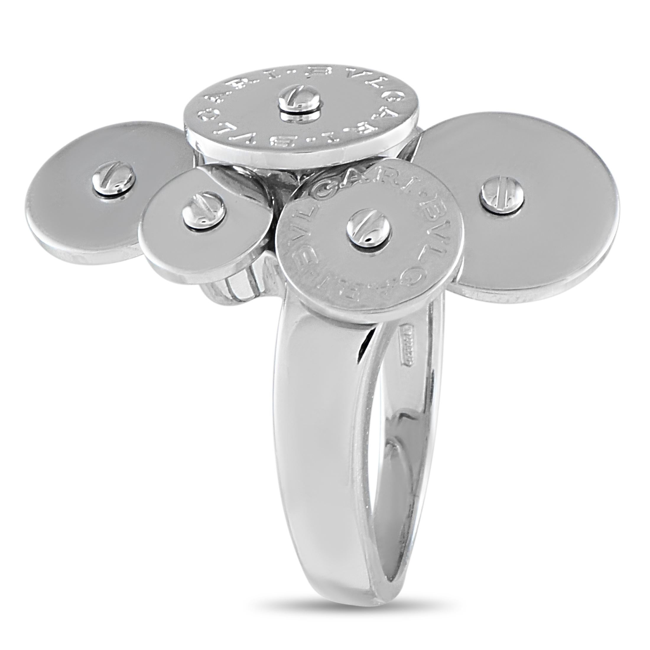 This Bvlgari Cicladi ring presents a fluid, sculptural design inspired by the Cyclades islands in Greece. It features a polished 18K white gold band topped with five overlapping discs, all punctuated by a screw motif at their center. Two discs are