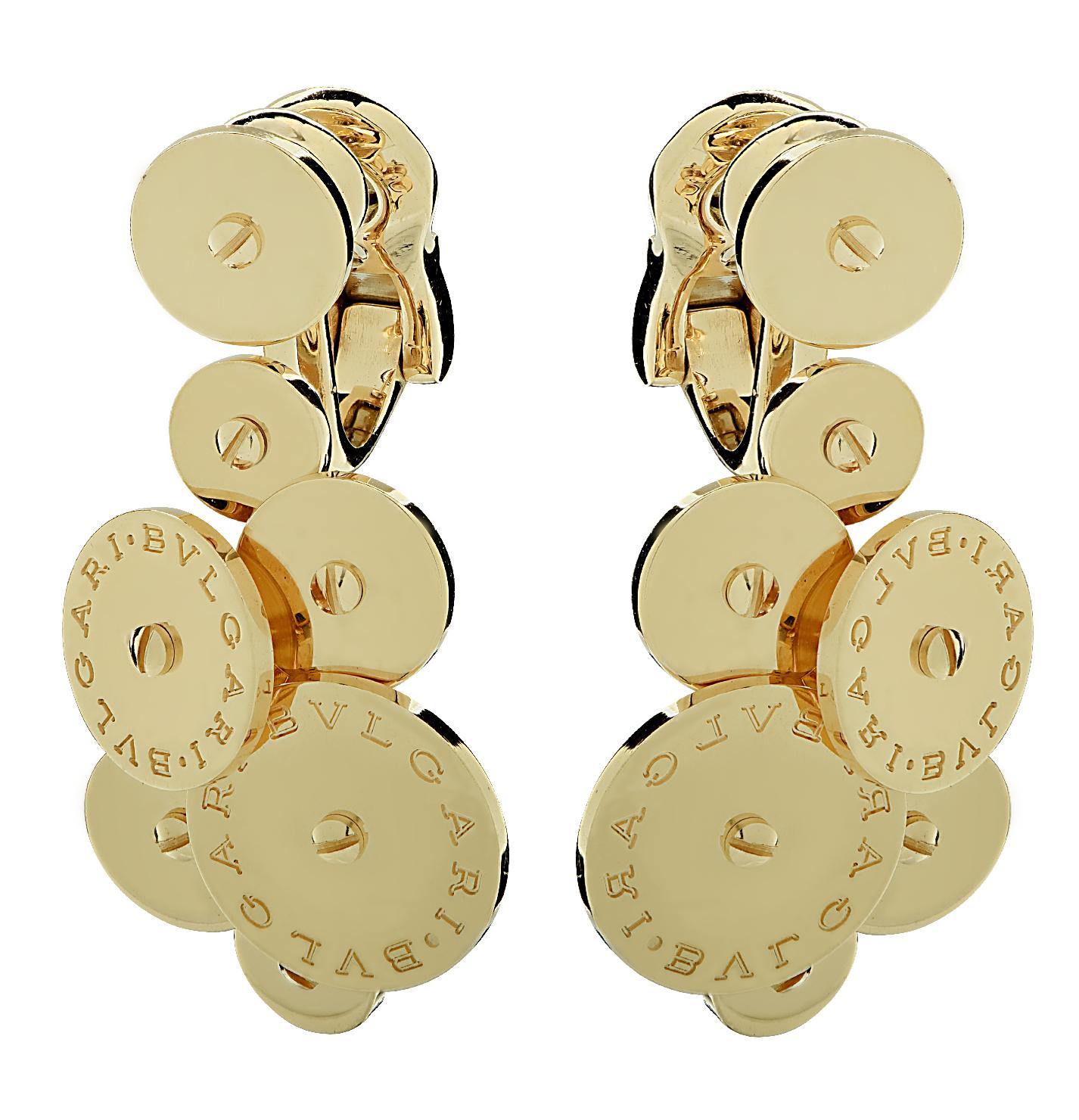 Stunning Bvlgari Cicladi earrings fuse elegance with modern design. Crafted in 18 karat yellow gold , showcasing gold discs fashioned into a bouquet of gold. This magnificent pair weighs a total of 22.3 grams. Each earring measures 7.92 mm, tapering