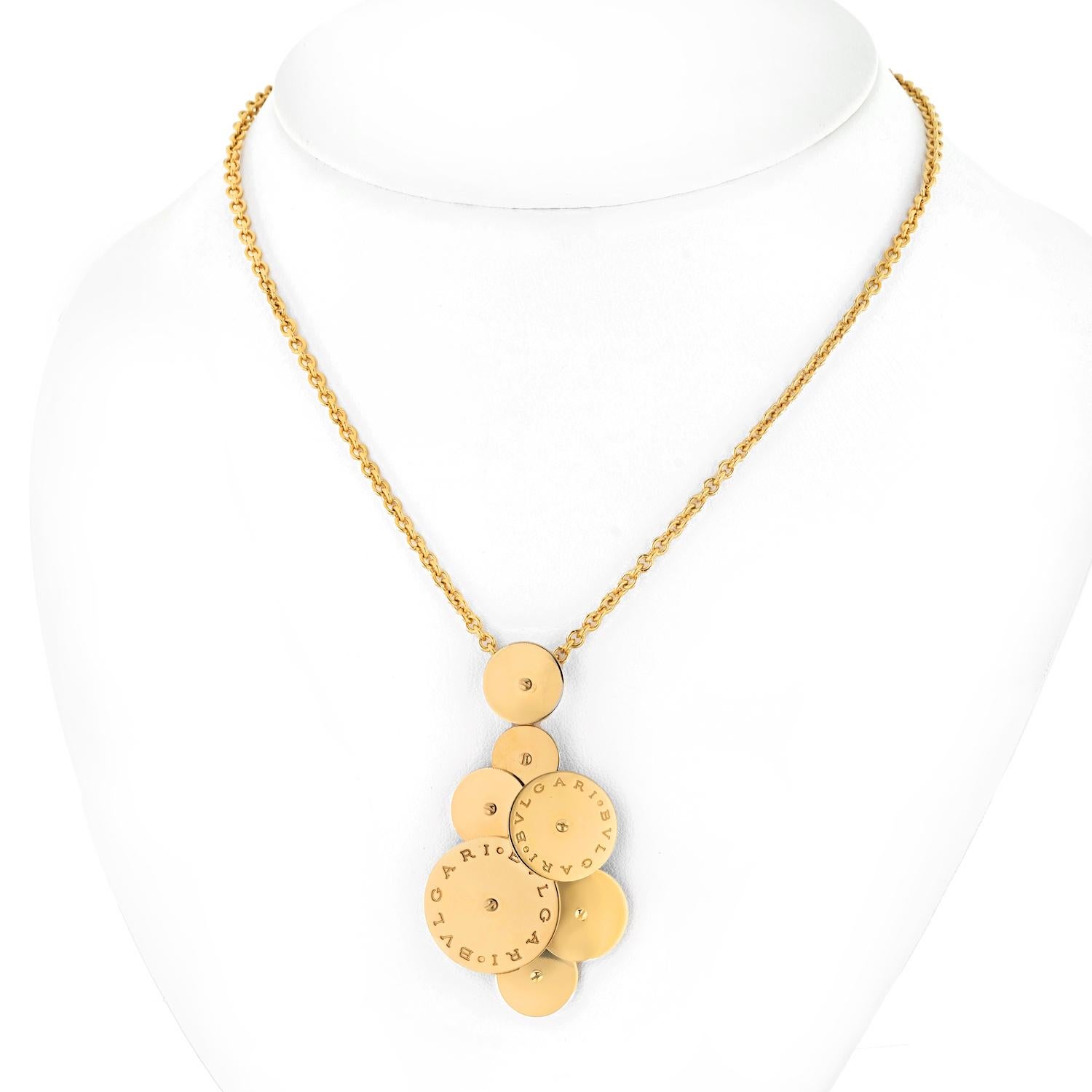 Discover the exquisite allure of this estate Bvlgari Cicladi 18k yellow gold necklace, a true testament to the brand's impeccable artistry. 

This captivating piece features a mesmerizing pendant of seven circles that gracefully rotate, creating an