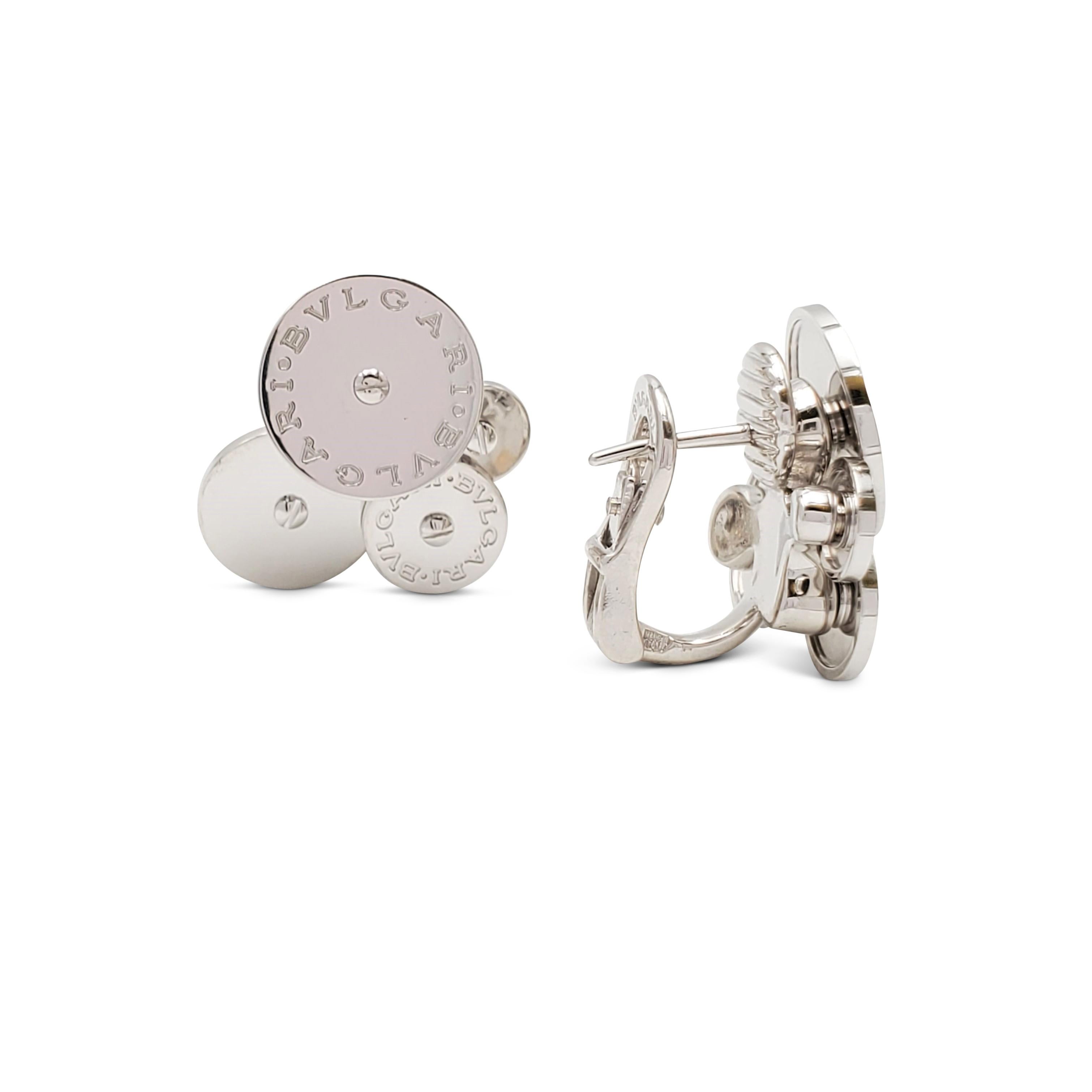 Authentic Bvlgari 'Cicladi' earrings crafted in 18 karat white gold. Each earring is composed of a cluster of 4 spinning circular discs, each graduating in size. The largest disc is engraved with the Bvlgari Bvlgari logo. The earrings measure 2 cm