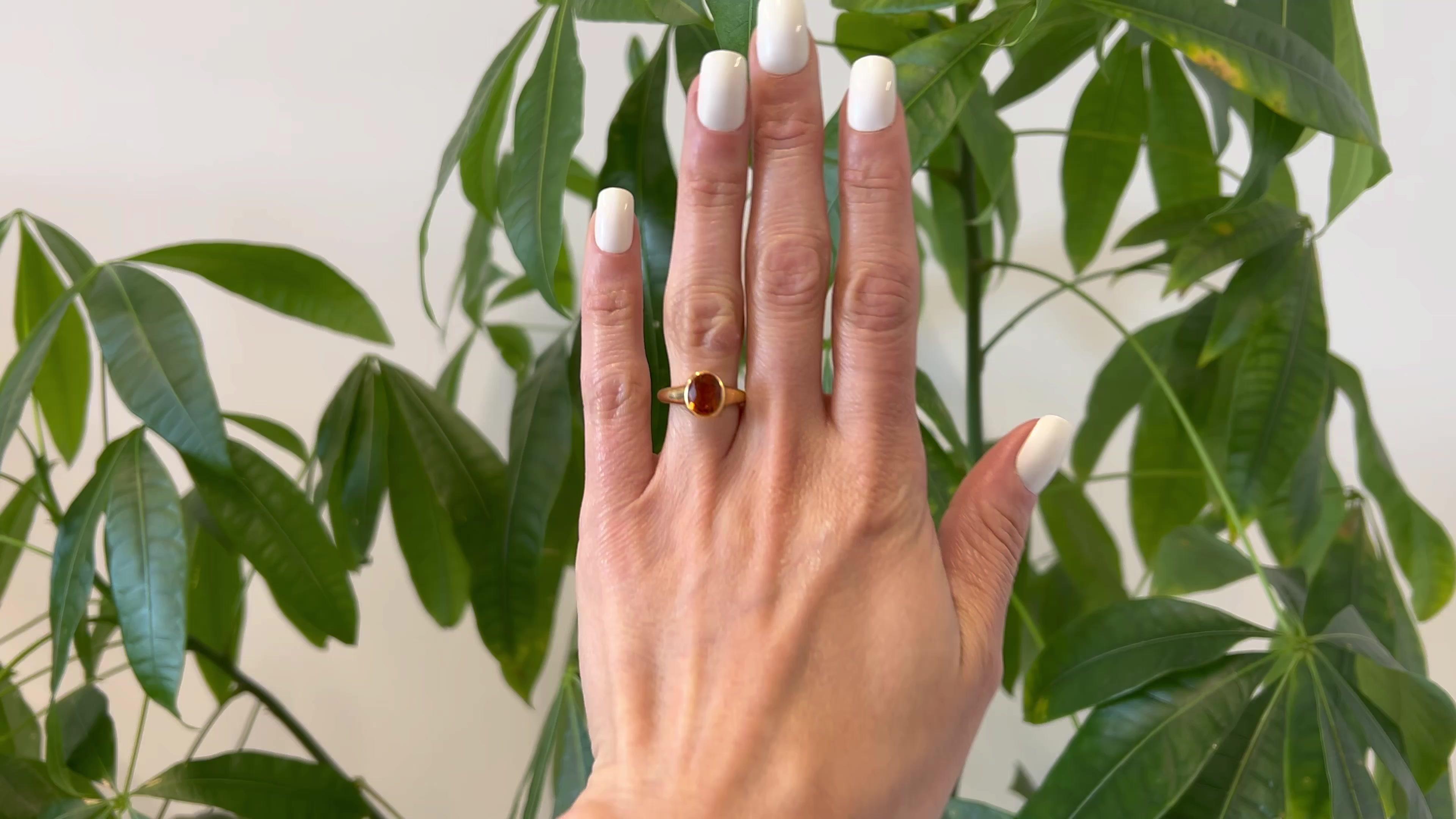 One Bvlgari Citrine 18k Yellow Gold Bezel Set Ring. Featuring one oval mixed cut citrine weighing approximately 1.50 carats. Crafted in 18 karat yellow gold signed Bvlgari with Italian hallmarks. Circa 2010. The ring is a size 6 ¼ and may be