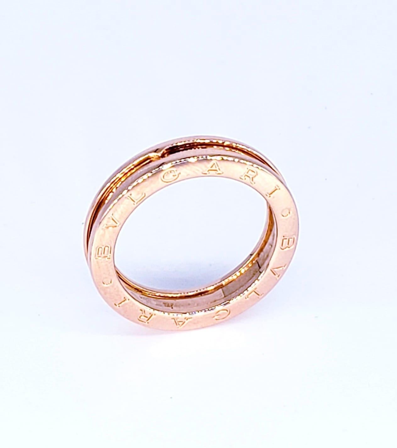 Bvlgari Classic 18k Rose Gold Wedding Band. Famous designer Bvlgari wedding ring size 9 and cannot be resized. The ring measures height 5mm and weights 8 grams solid 18k rose gold. Stamped 750