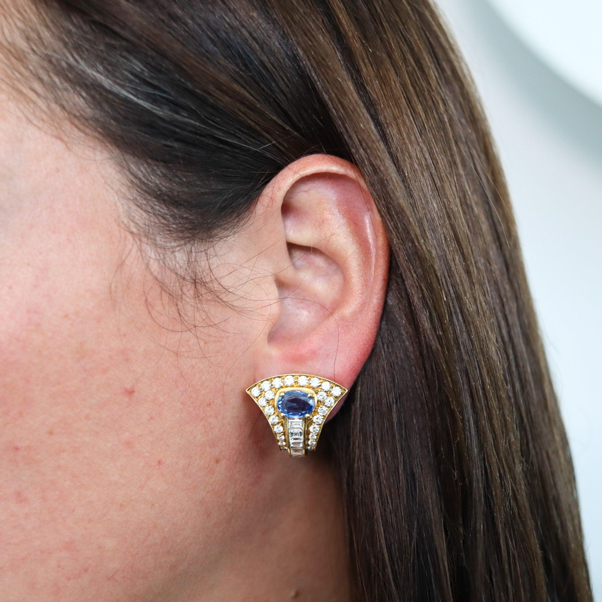 Gems-set earrings designed by Bvlgari.

This is a great pair of clips-on earrings, created in Milano Italy by the jewelry house of Bvlgari. These earrings were crafted in solid yellow gold of 18 karats, with high polished finish. They are from the