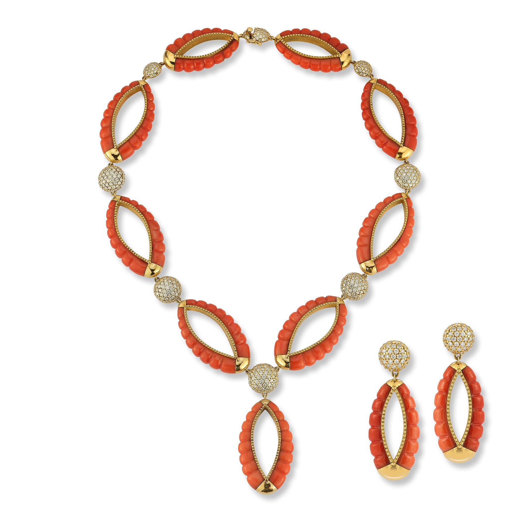Bulgari Coral and Diamond Necklace and Earrings

Links of carved coral with pave diamond links.

Necklace Measurements: 18