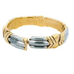 Bvlgari cuff 18k/pt wide white fluted sect betw yg arrows