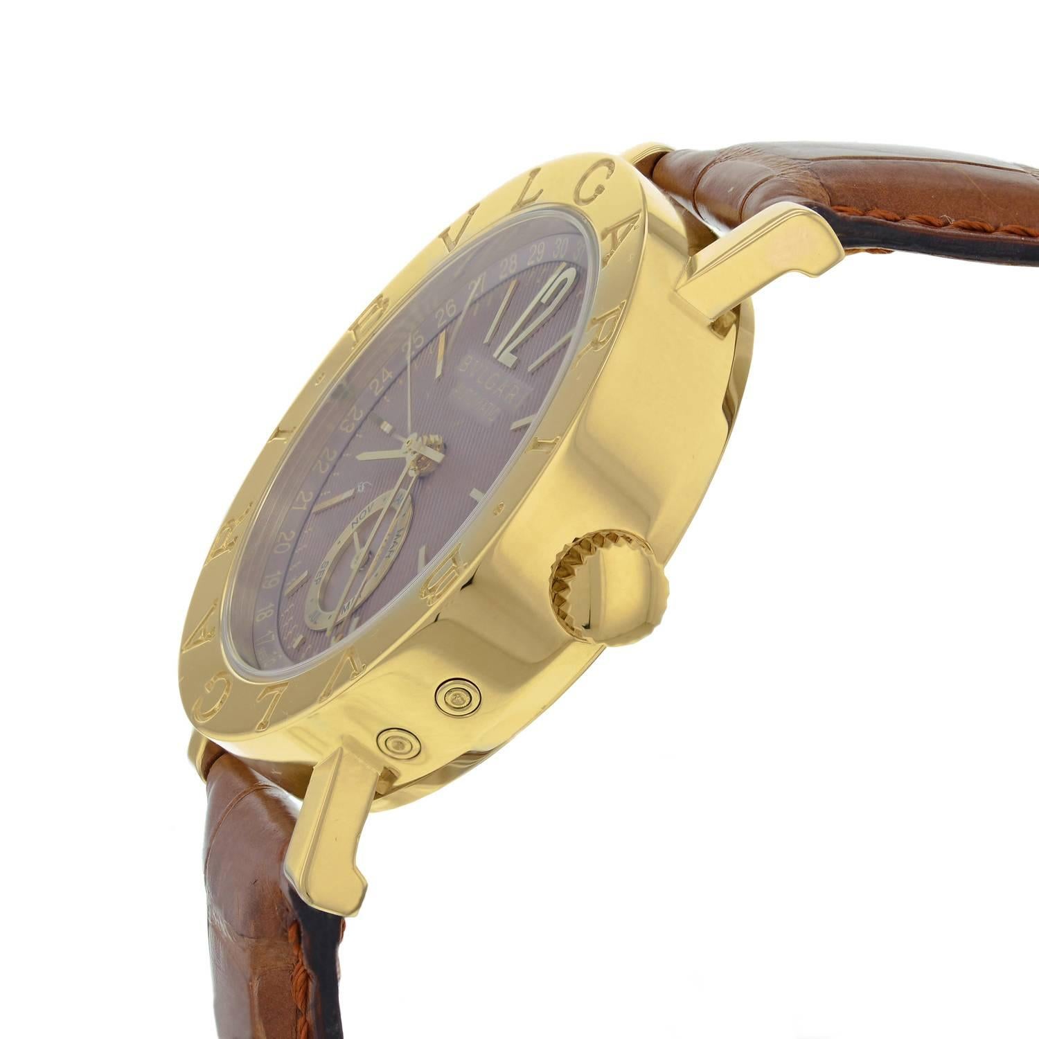 This brand new Bvlgari Diagono BB 38 GL AC is a beautiful men's timepiece that is powered by an automatic movement which is cased in a yellow gold case. It has a round shape face, gold case dial and has hand arabic numerals style markers. It is