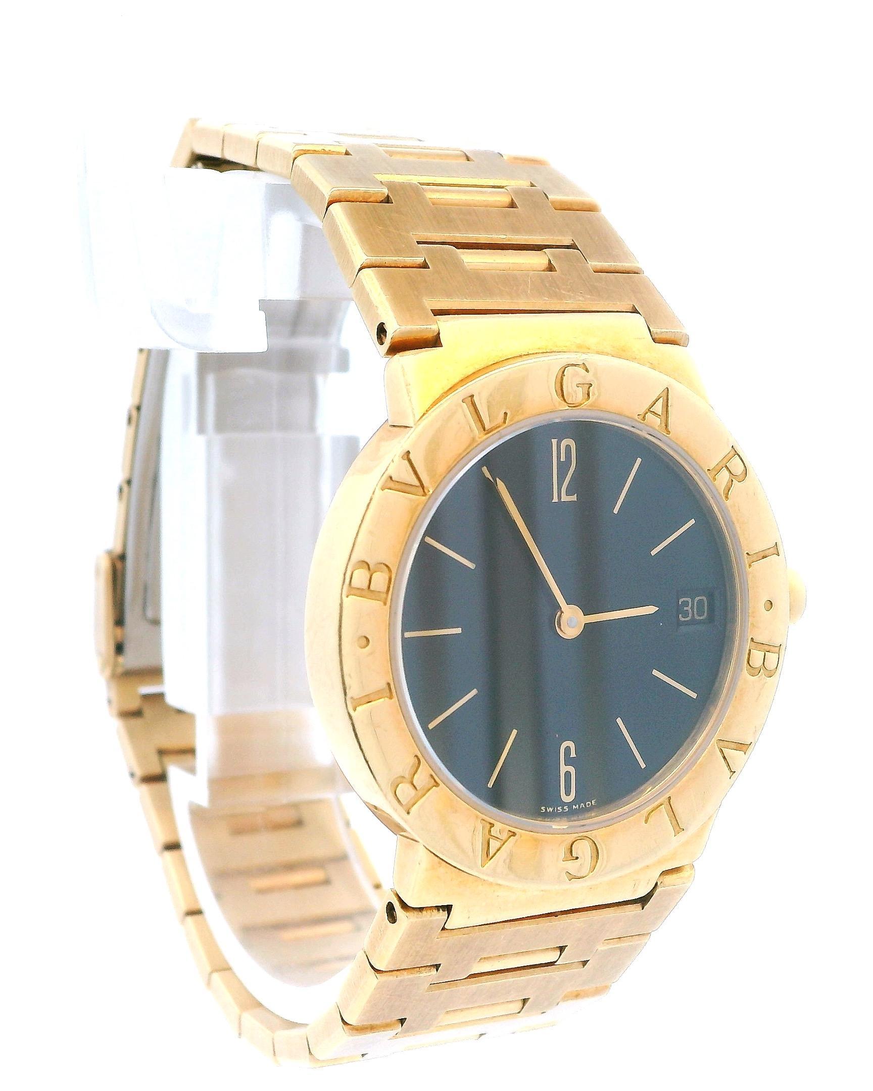 Bvlgari Diagono BB30GGD Ladies Watch. 30mm 18K yellow gold case with 18K yellow gold bezel. Black dial with gold hands and index & Arabic numeral hour markers. Date display at the 3 o'clock position. 18K yellow gold bracelet with an 18K white gold