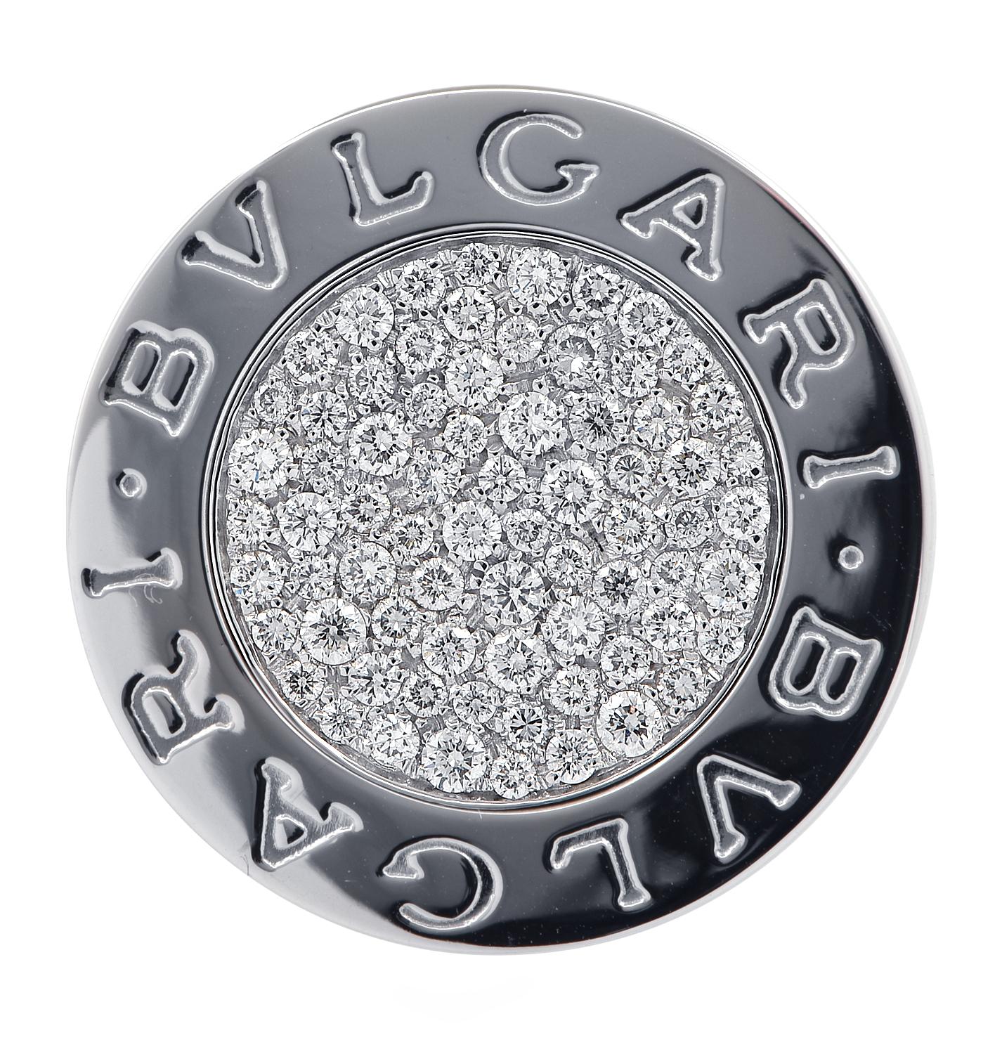 From the renowned House of Bvlgari, this stylish ring crafted in 18 karat White Gold showcases the BVLGARI double logo with an inlay featuring 75 round brilliant cut diamonds weighing approximately 1.5 carats total, F color, VS clarity, pave set.