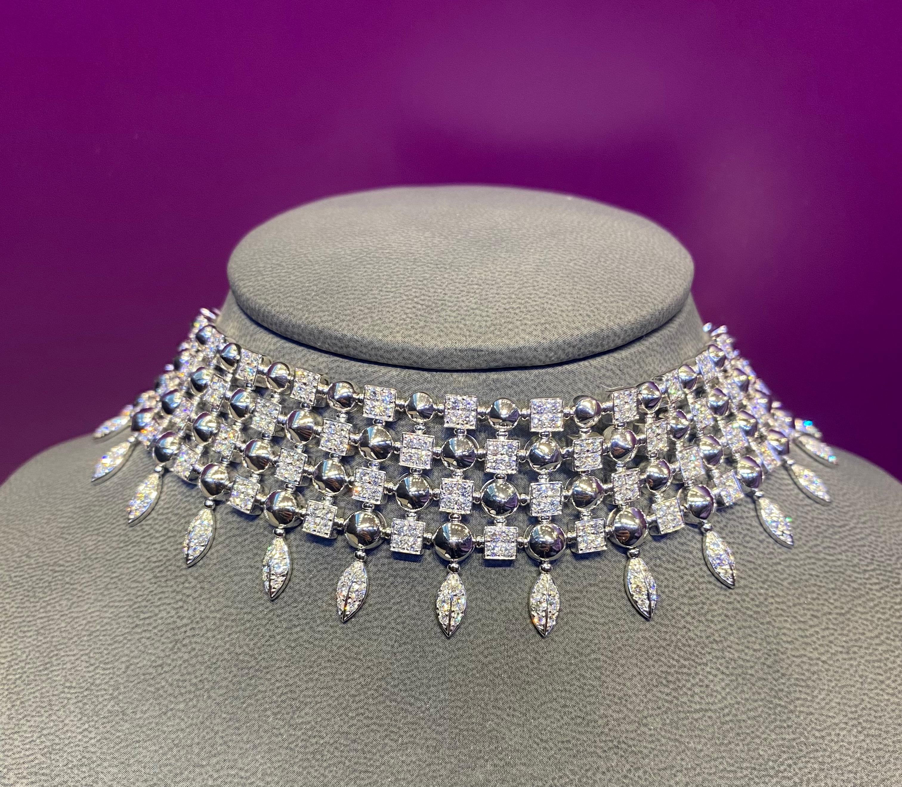 Bulgari Diamond Choker Necklace.

A choker featuring 4 rows of pave diamond links set in 18 karat white gold round 

Measurements: 13.5