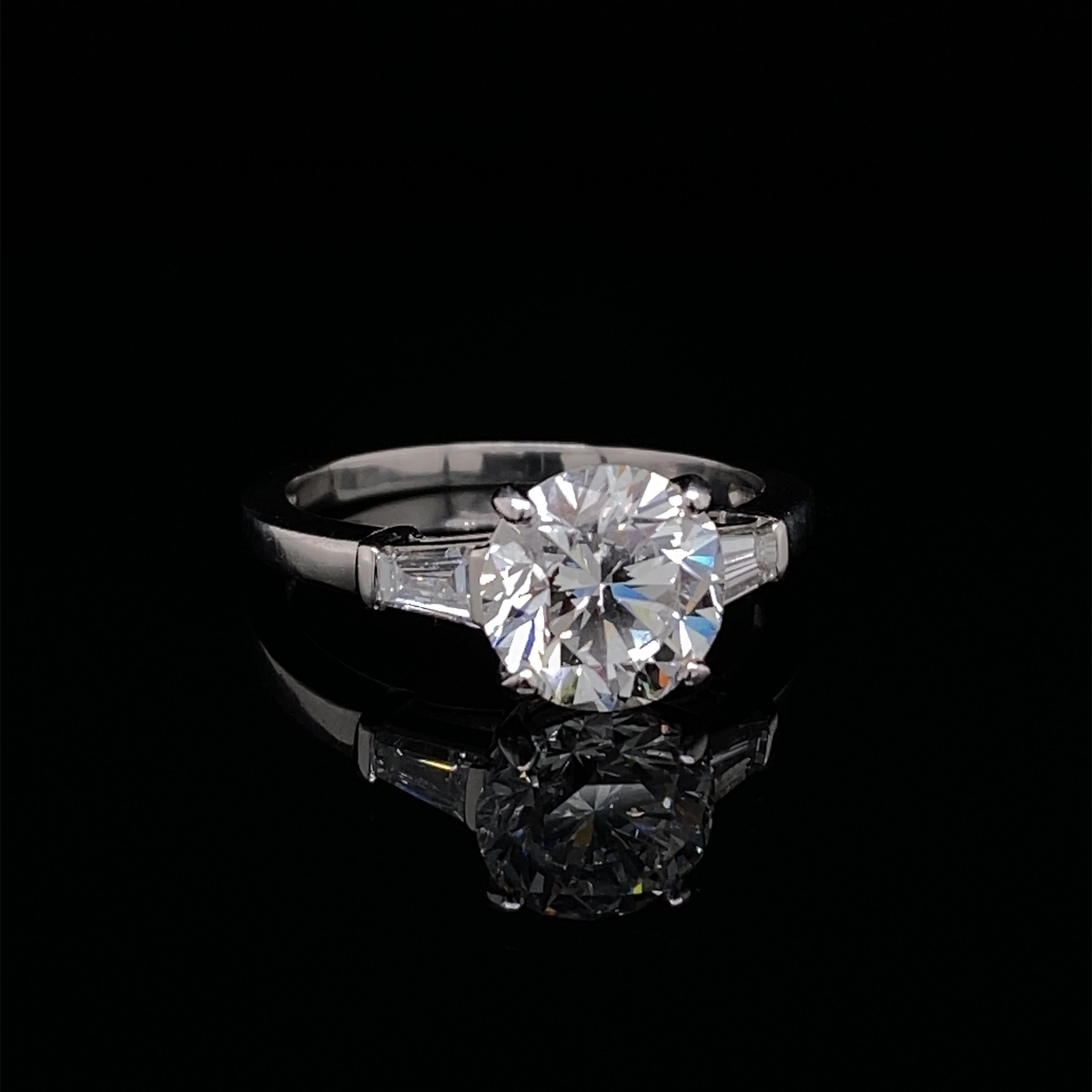 A Bvlgari diamond engagement ring in platinum of 2.02 carat.

An exceptional Art Deco inspired diamond solitaire engagement ring set in platinum by the Italian Jewellery House Bvlgari.

The ring is set to its centre with a 2.02 carat round brilliant