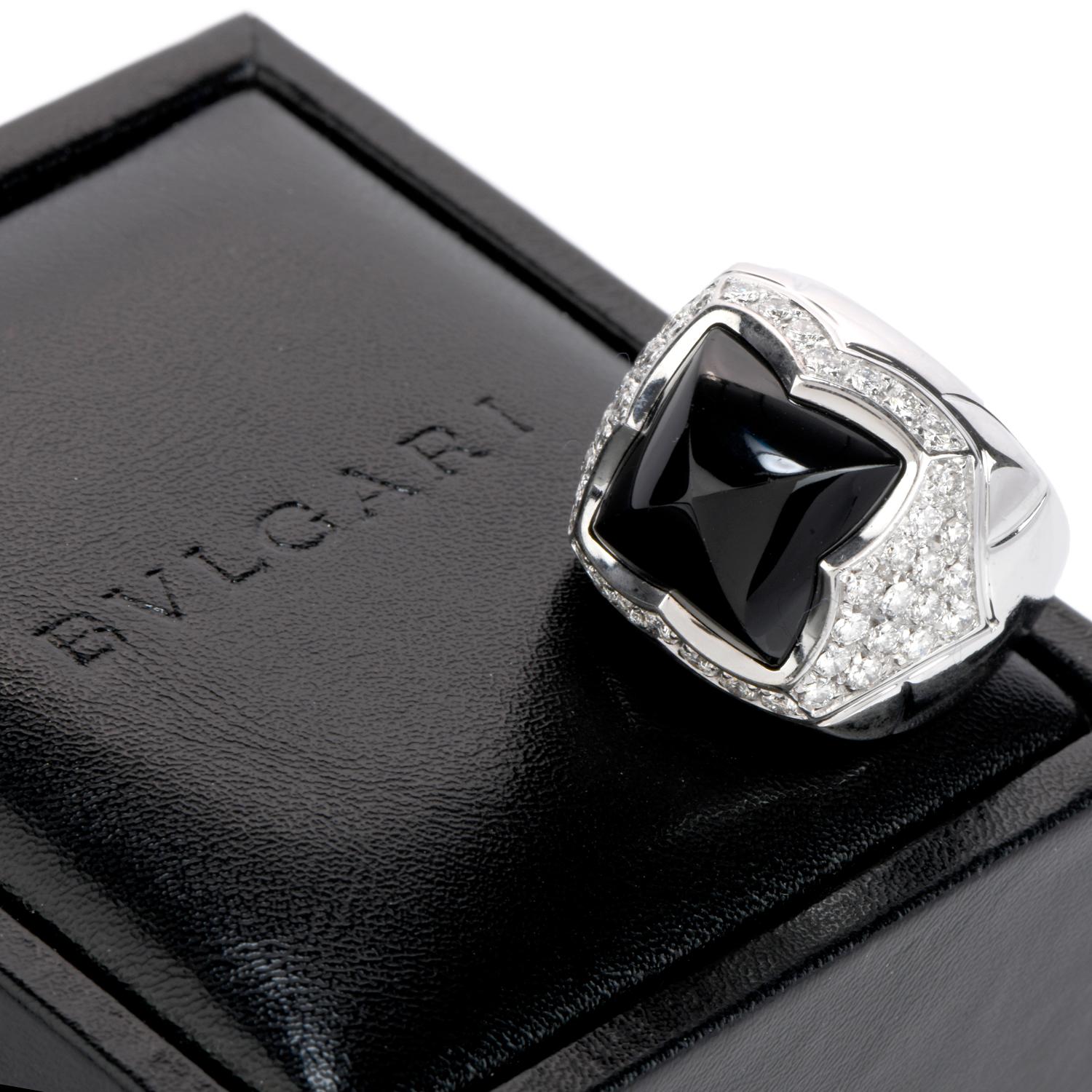 Marvel in delight at this fashionable Bvlgari Diamond Onyx 18K Gold Pyramid Cabochon Ring!  This designer ring is crafted

in 18 karat white gold and is purity marked.  There are approximately 46 genuine diamonds, round cut, pave set, totaling

1.35