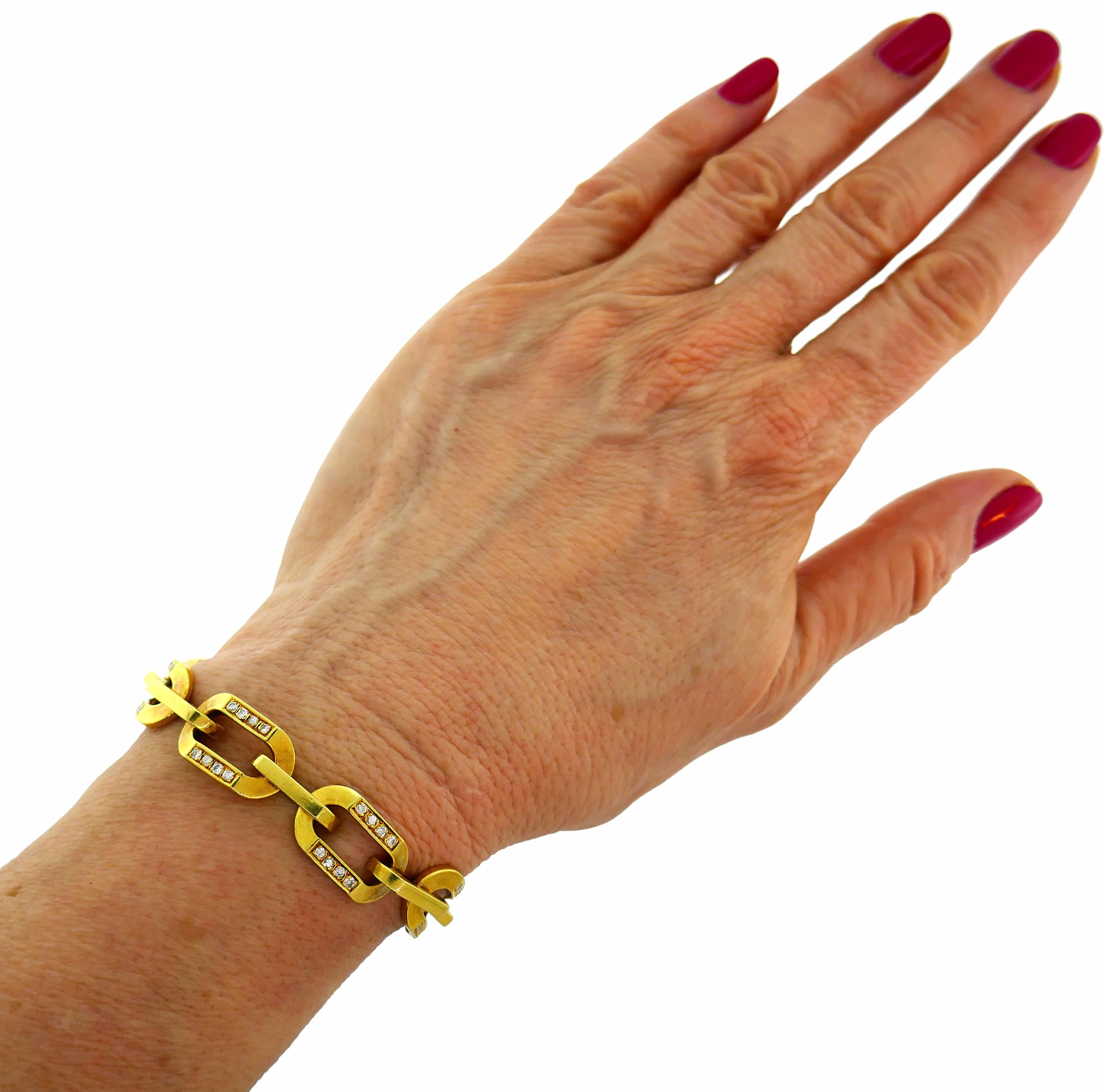 Bold yet elegant bracelet created by Bulgari in Italy in the 1980s. Chic and wearable, the bracelet is a great addition to your jewelry collection. 
The bracelet is made of 18 karat yellow gold and set with round brilliant cut diamonds (F-G color,