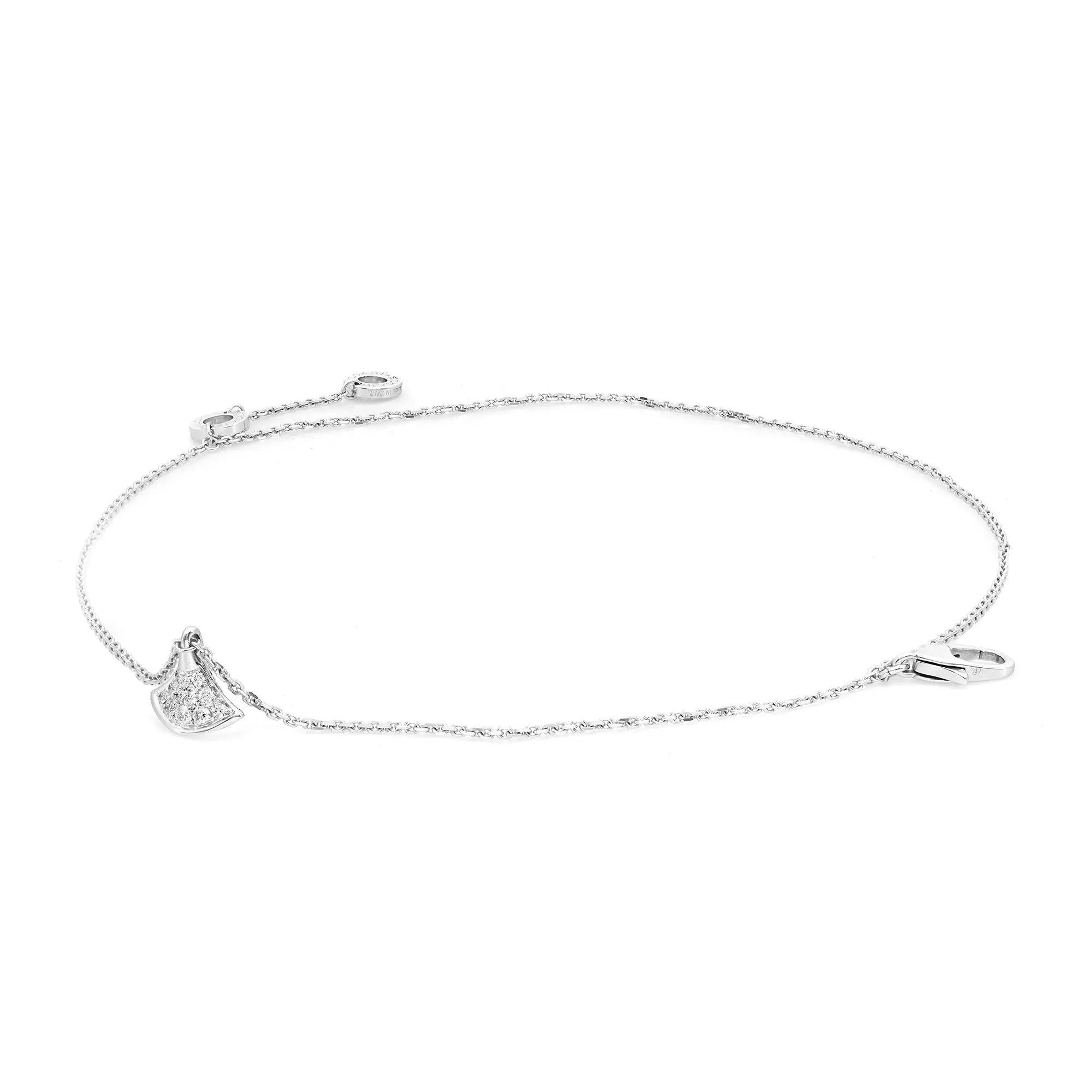 Quintessentially feminine with enchanting allure, this bracelet reflects the very essence of Italian beauty. Crafted in lustrous 18K white gold. It features a double chain bracelet with a hanging charm in the middle studded with round brilliant cut