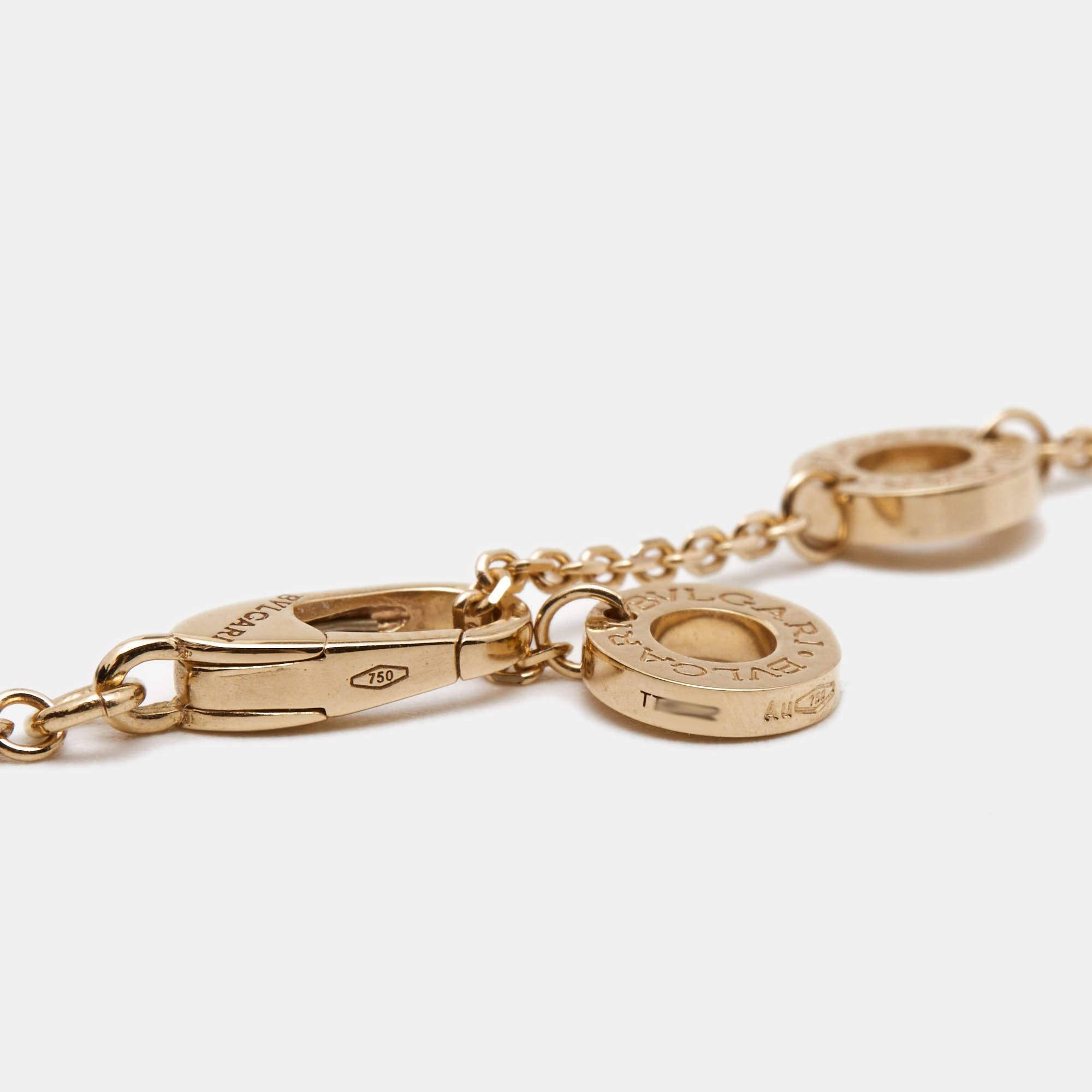 The Bvlgari Divas' necklace is an exquisite piece of jewelry that exudes elegance and luxury. Crafted from lustrous 18k rose gold, it features a pendant inspired by the brand's iconic fan-shaped motif, adorned with sparkling diamonds, creating a