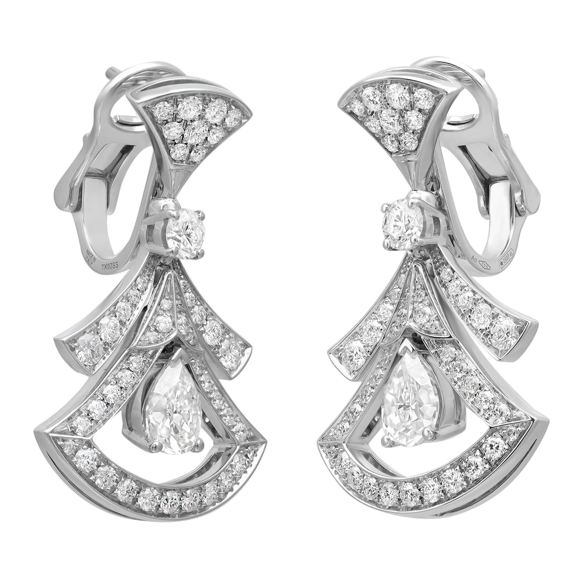 Quintessentially feminine and glamorous, these earrings capture the essence of Italian beauty. Crafted in lustrous 18K white gold. These earrings feature fan shaped motifs studded with pave set round cut diamonds weighing 1.18 carats with two prong