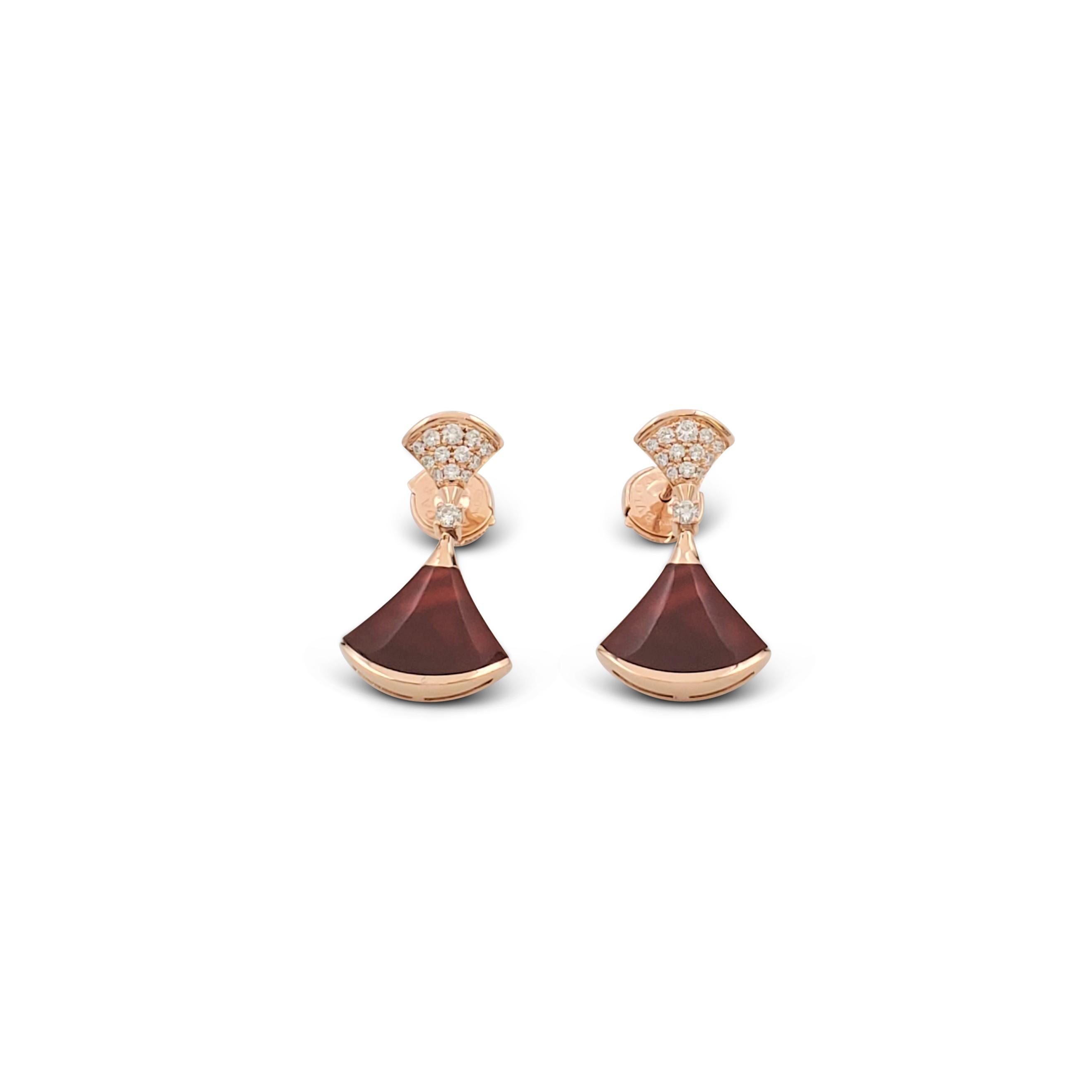Authentic Bvlgari earrings from the 'Diva's Dream' collection are crafted in 18 karat rose gold. The surmounts are set with round brilliant cut diamonds weighing an estimated 0.30 carats total, suspending a polished carnelian drop. Signed Bvlgari,
