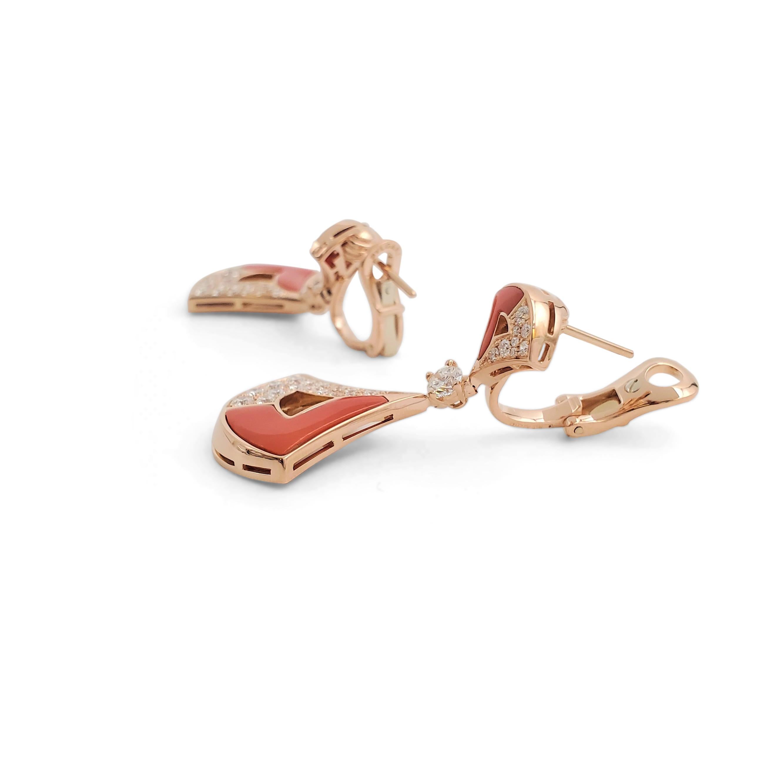 Authentic feminine and elegant Bvlgari earrings from the 'Divas' Dream' collection. Crafted in 18 karat rose gold, the earrings feature fan-shaped elements set with contrasting carved coral and sparkling round brilliant cut diamonds weighing an