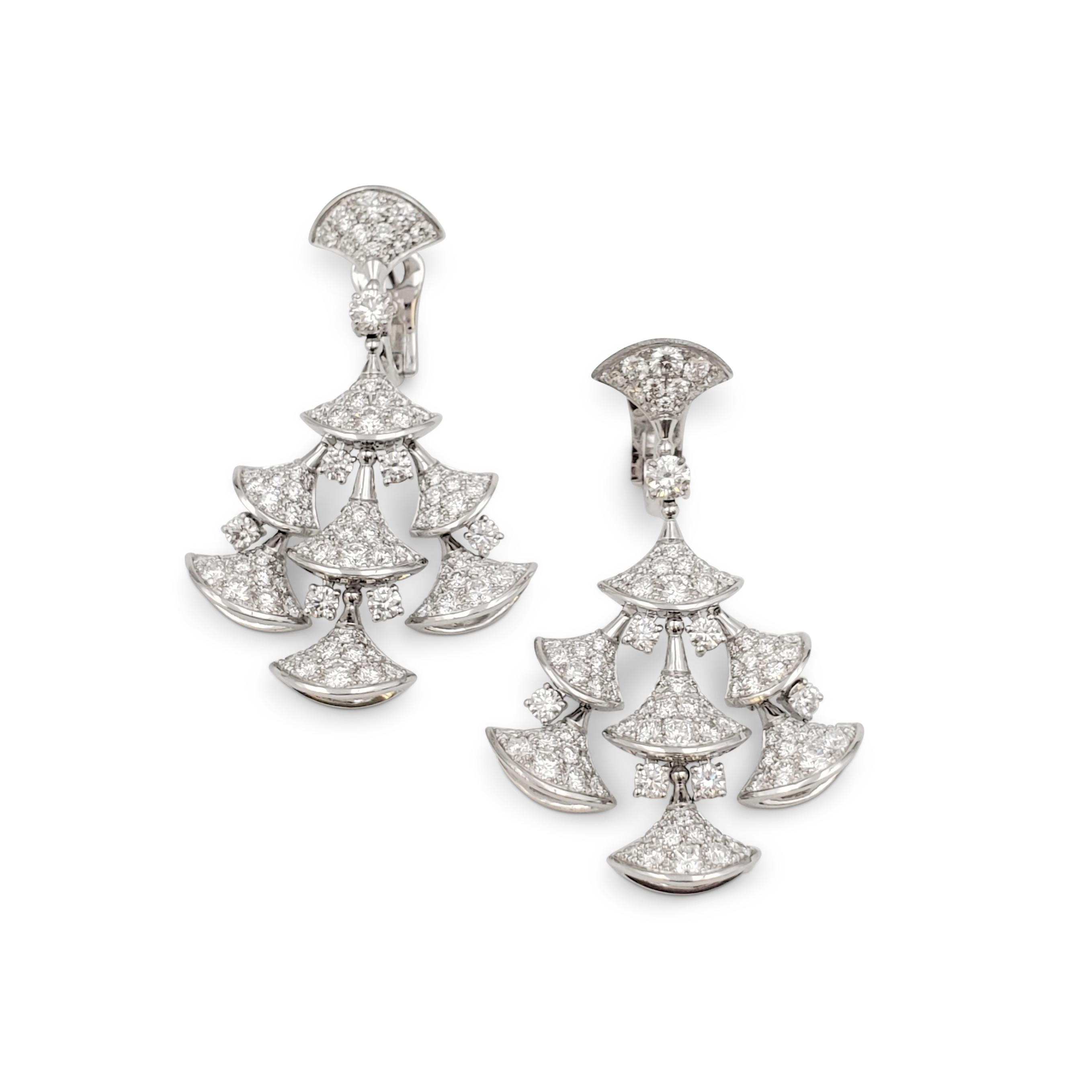 Authentic glamourous Bvlgari earrings from the 'Divas' Dream' collection center on dancing fan-shaped elements crafted in 18 karat white gold and set with an estimated 7.94 carats of high-quality round brilliant cut diamonds (E-F, VS). Signed