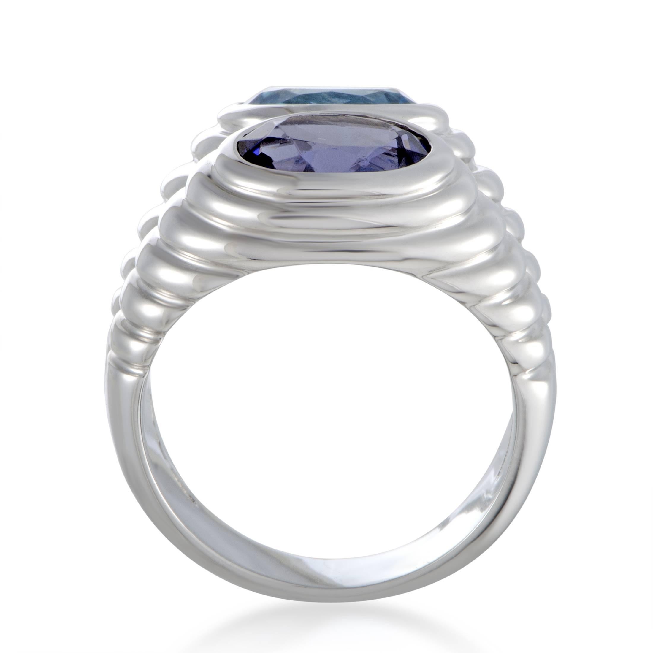 Presenting a perfect backdrop for the alluring gemstones, the 18K white gold gives a gorgeously elegant appeal to this fascinating piece from Bvlgari. The ring is set with a sublime topaz and an eye-catching iolite. Ring Top Dimensions: 15mm x 10mm