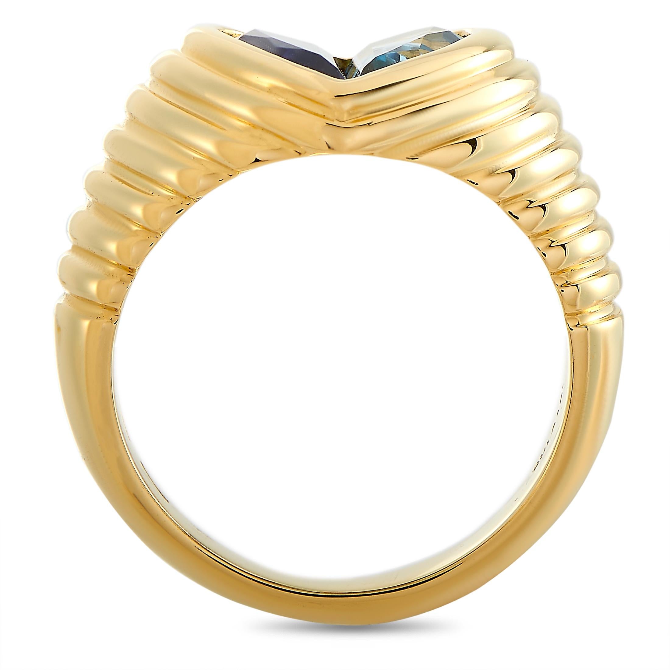 The Bvlgari “Doppio” ring is made of 18K yellow gold and embellished with a topaz and an iolite. The ring weighs 12.1 grams and boasts band thickness of 4 mm and top height of 5 mm, while top dimensions measure 12 by 11 mm.
 
 This jewelry piece is