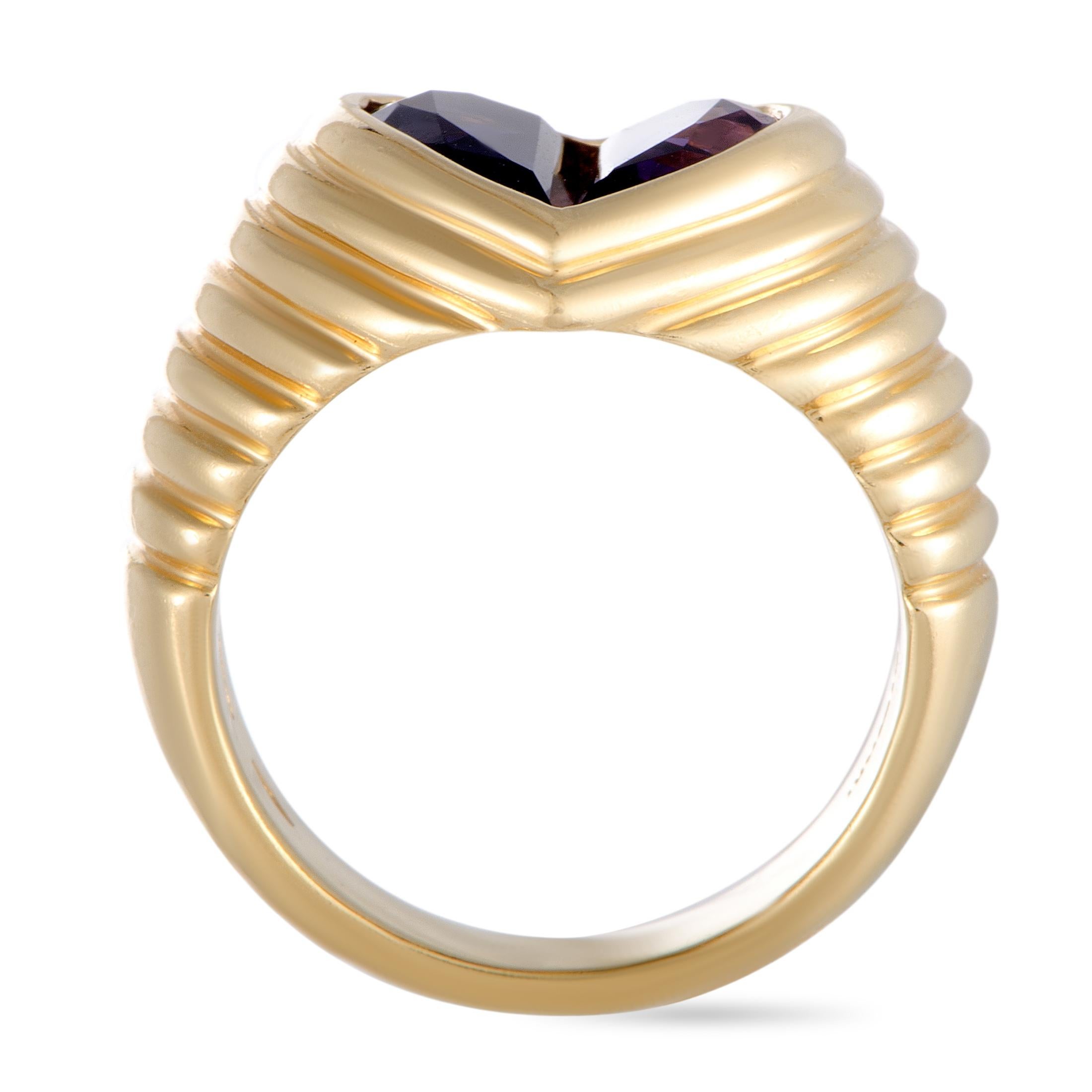 The Bvlgari “Doppio” ring is made of 18K yellow gold and set with an amethyst and an iolite. The ring weighs 10.9 grams, boasting band thickness of 5 mm and top height of 3 mm, while top dimensions measure 10 by 10 mm.

This item is offered in