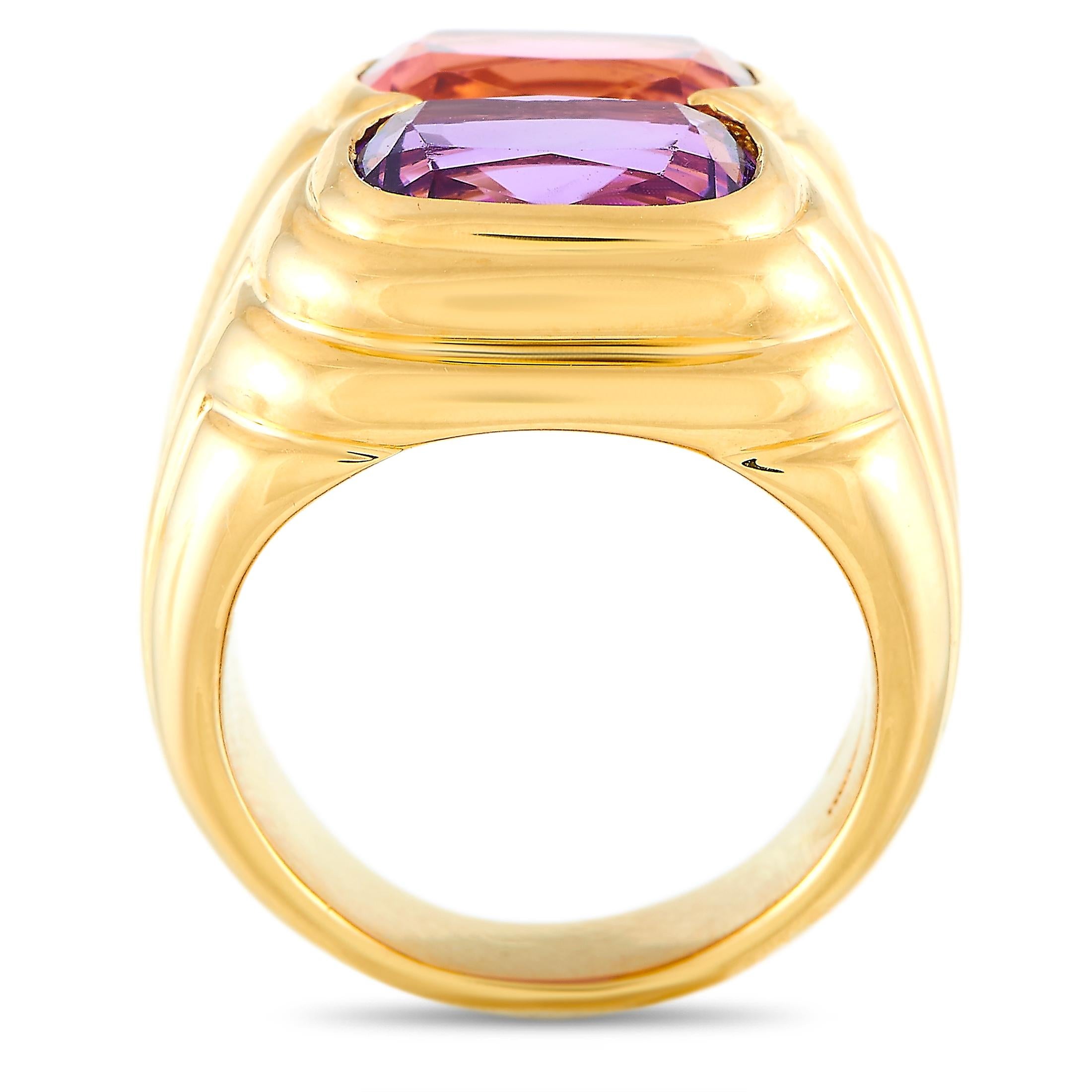 The Bvlgari “Doppio” ring is crafted from 18K yellow gold and set with an amethyst and a tourmaline. The ring weighs 20.9 grams and boasts band thickness of 15 mm and top height of 8 mm, while top dimensions measure 20 by 19 mm.
 
 This item is