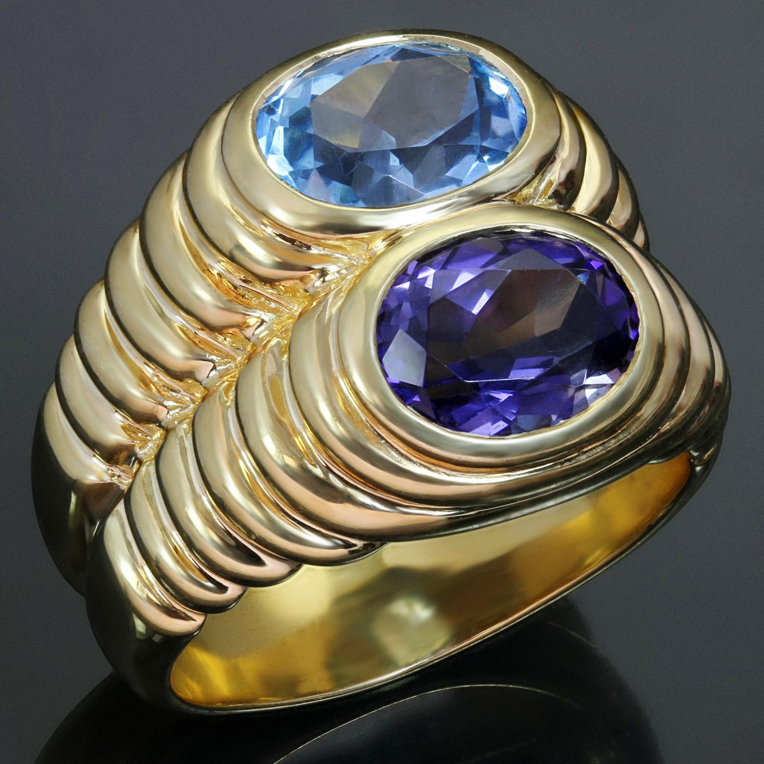 This fabulous Bvlgari ring is crafted in 18k yellow gold and set with oval blue topaz and purple iolite gemstones. Made in Italy circa 1980s. Measurements: 0.62