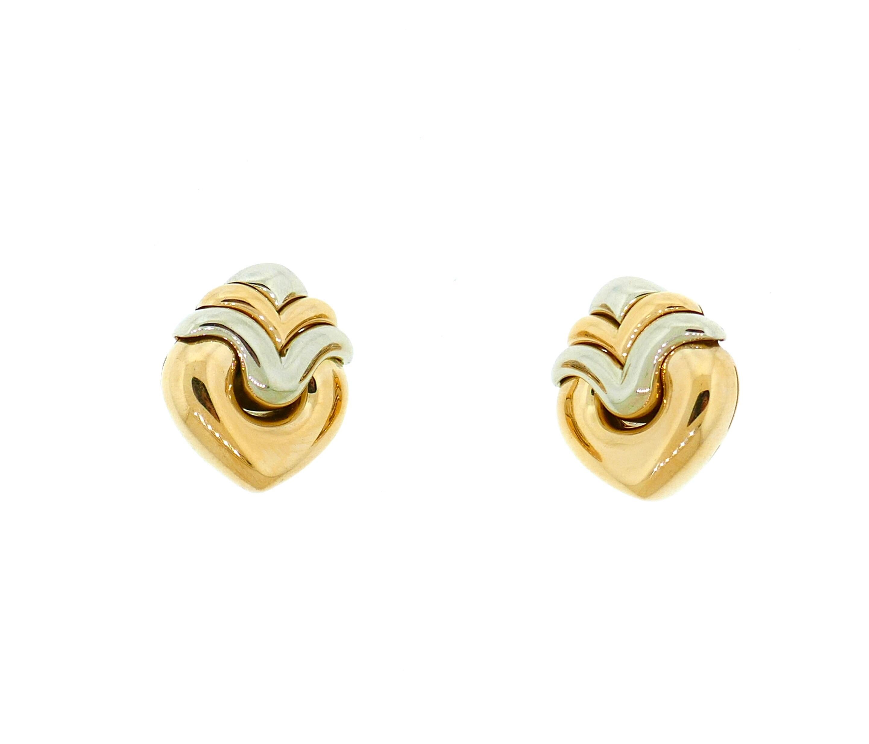 Bulgari Doppio Cuore 18 Karat Yellow White Gold Heart Shaped Earrings

These are beautiful and classic Bvlgari earrings. They feature a heart motif comprised of 18 karat yellow and white gold. 

Dimensions: 1.13