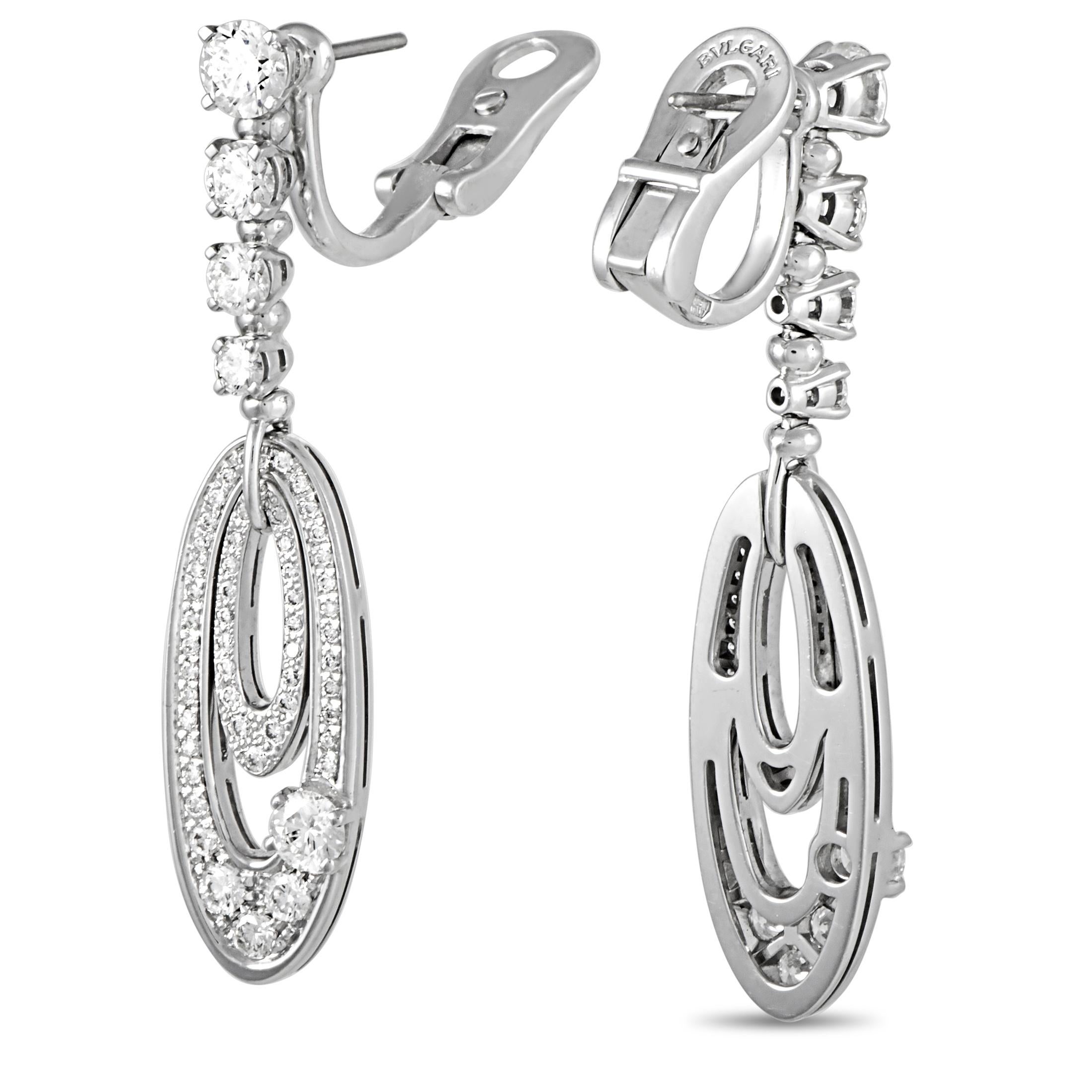 The Bvlgari “Elisia” earrings are made of 18K white gold and each weighs 7.6 grams. They measure 1.80” in length and 0.40” in width. The earrings are embellished with diamonds that boast grade F color and VS1 clarity and amount to 3.00 carats.
 
