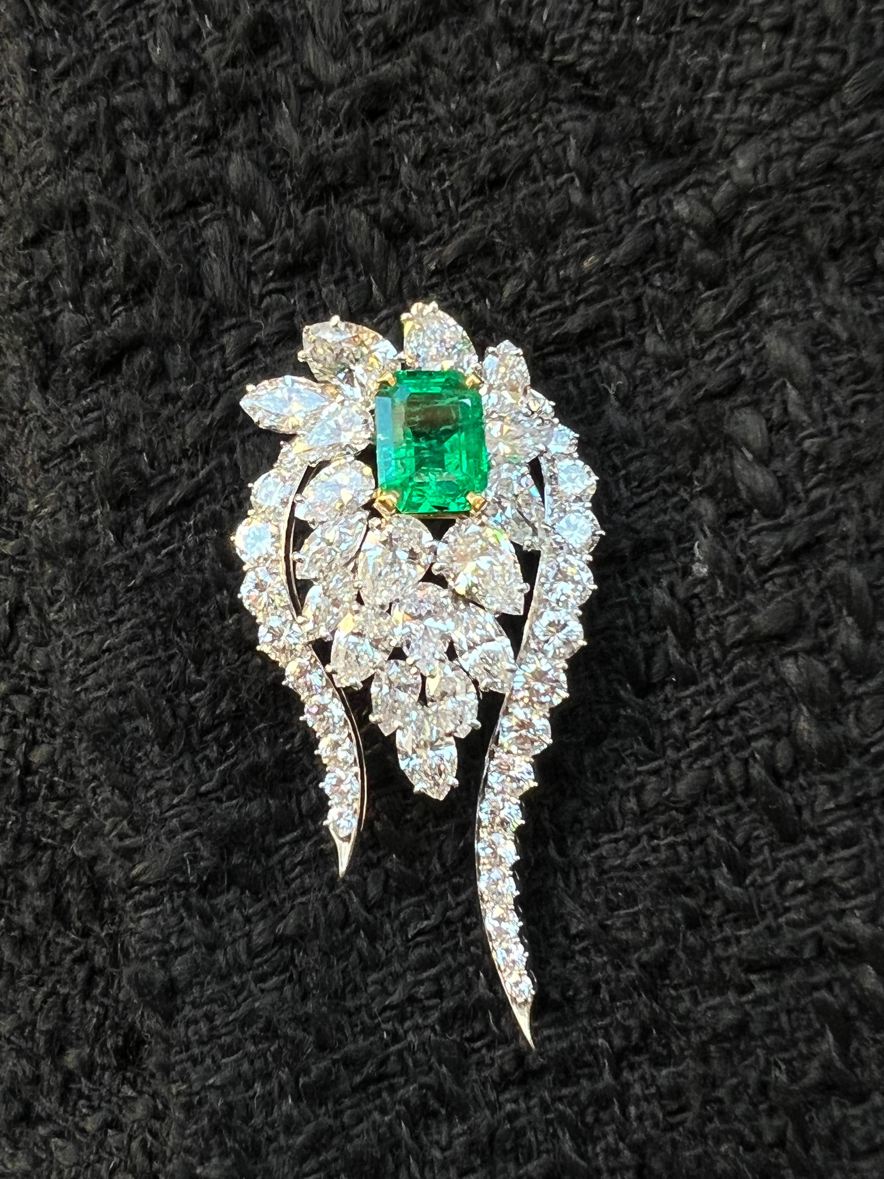 classy brooch/pendent by Bulgari in the 1930-1940s.
colorful, elegant and wearable . the brooch/pendent is made of 18 karat white gold and features a gorgeous 4 carat Colombian emerald accompanied with a AGL emerald origin report ( last photo ) and