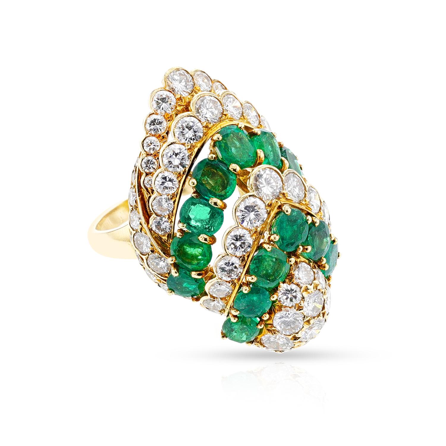 This stunning Bvlgari Emerald and Diamond Cocktail Ring is crafted from 18k yellow gold and flaunts beautiful ornamental design. The ring has a combined weight of 17 grams and measures 1.25 x 1.18 inches, and is a size 6.50 US. A Letter of