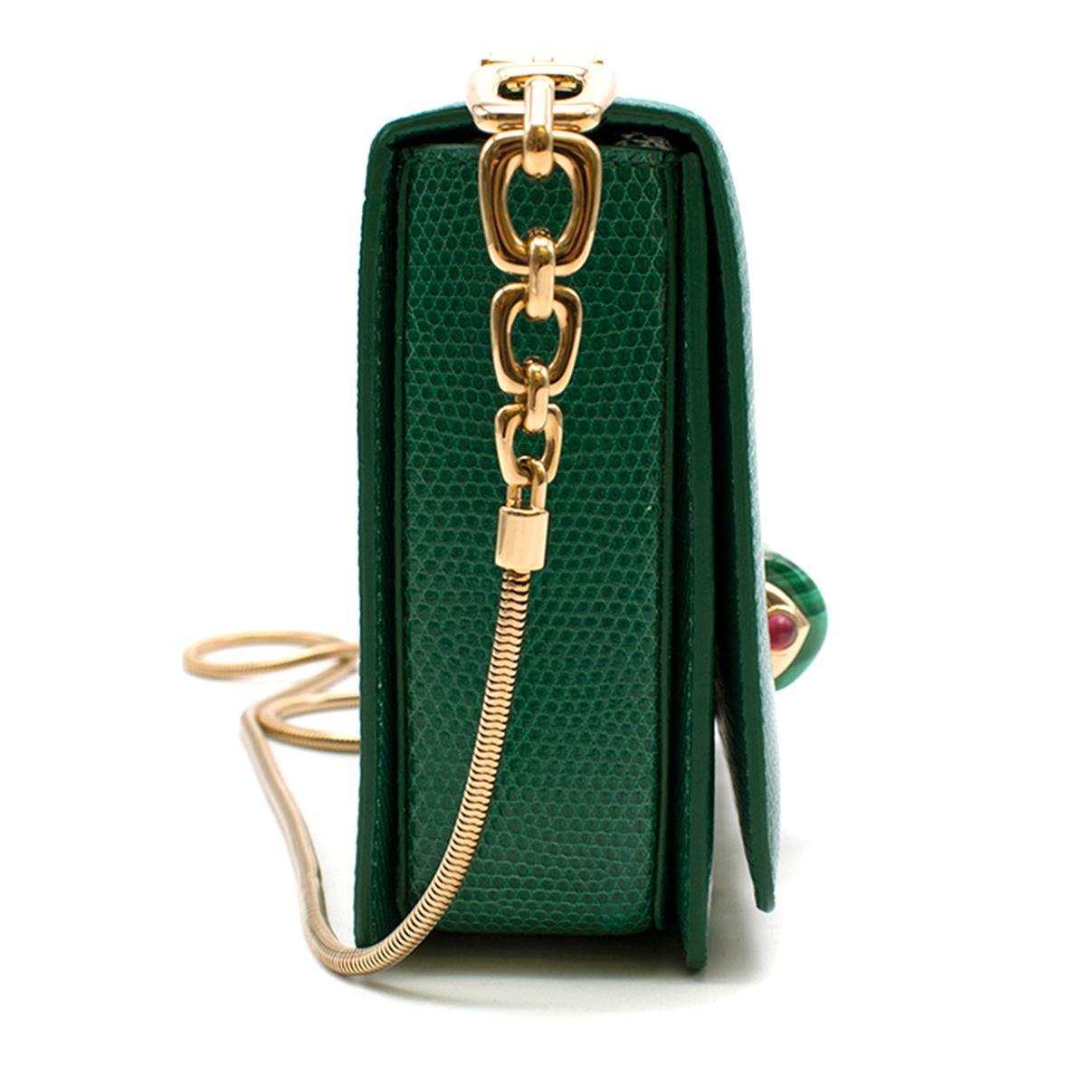 Bvlgari Emerald Green Lizard Box Bag W/ Jade & Cabochon Clasp

- Lizard leather mini box shoulder bag 
- Embellished with jade & pink cabochon clasp to the front
- Gold tone metal chain 
- Gold tone plate to the top of the bag with chain
- Flap